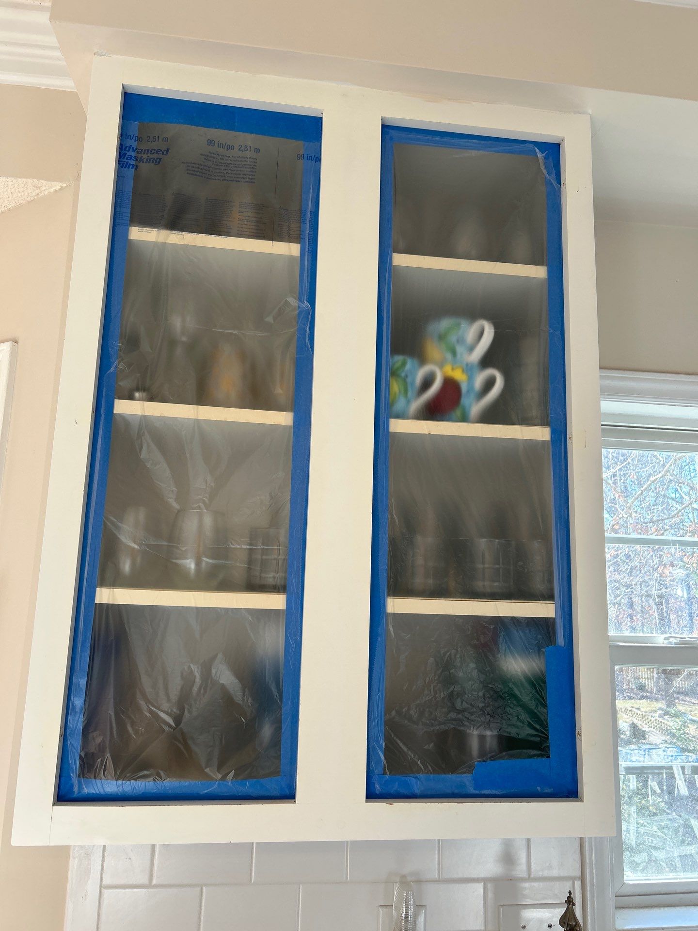 Cabinet painting by GonzalezPainters & Contractors Inc 
