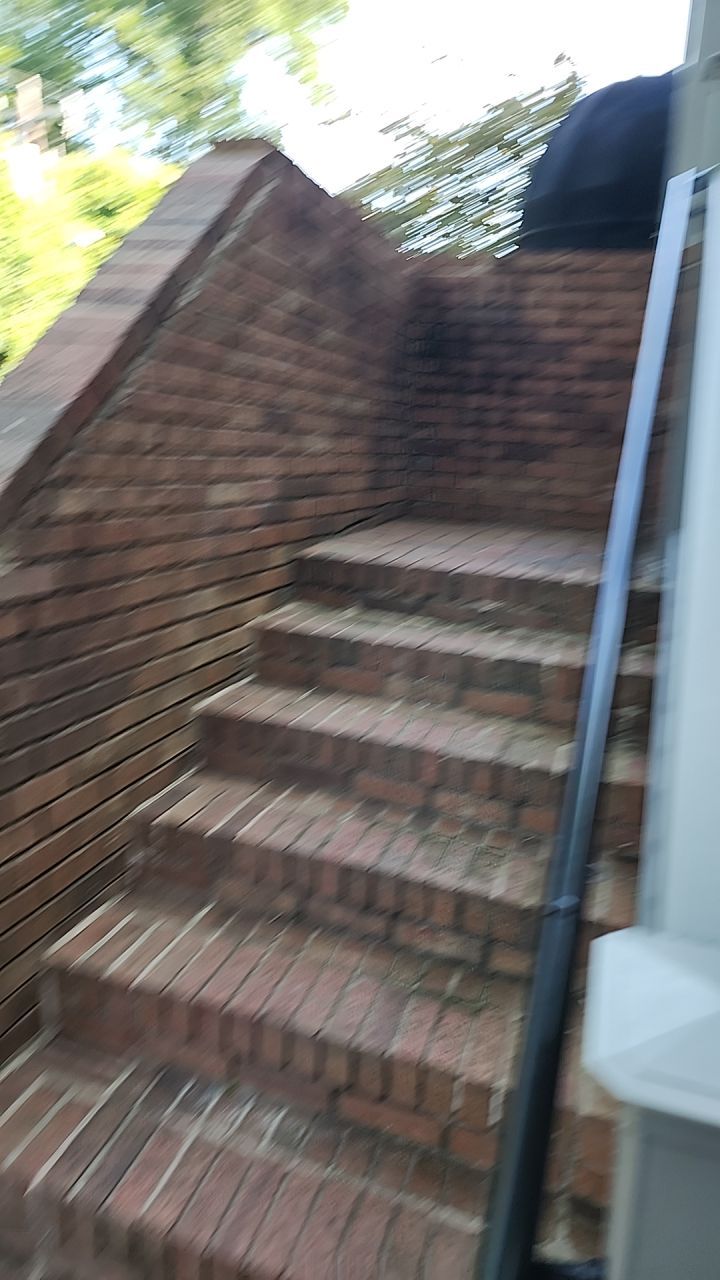building clean using cleaner by Power Wash Masters LLC
