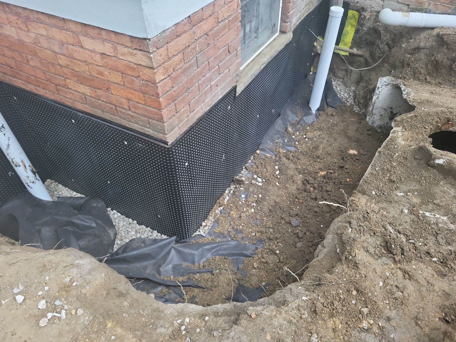 Exterior Basement Waterproofing & Combo Sump Backup System by Toledo Basement Repair