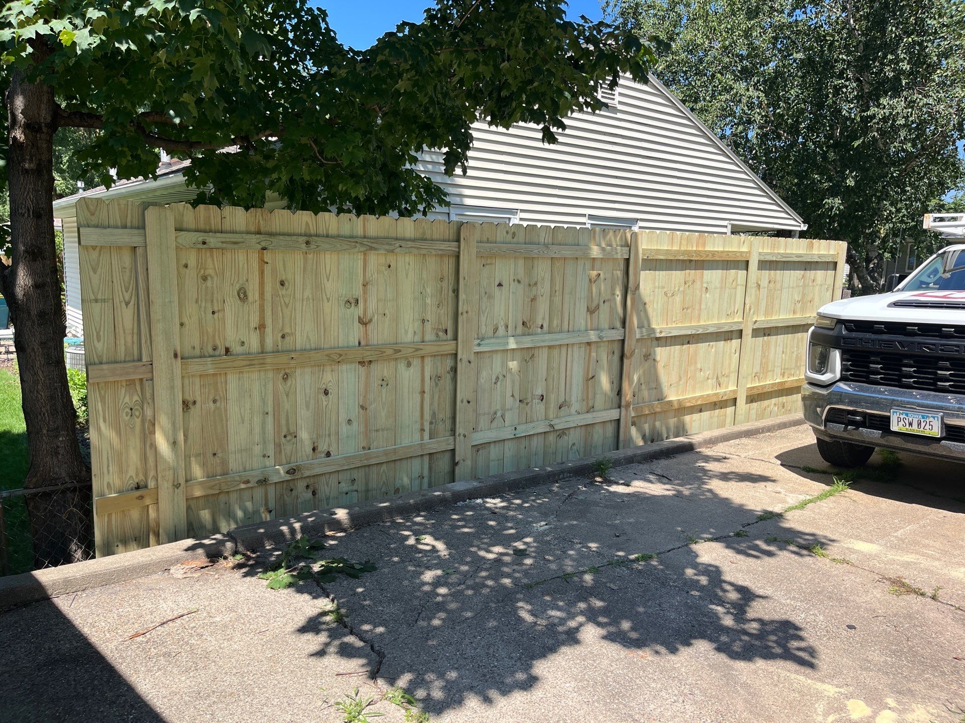 Pressure-Treated Wood Privacy Fence Installation in Cedar Falls by Perfect Picket Fence and Stain
