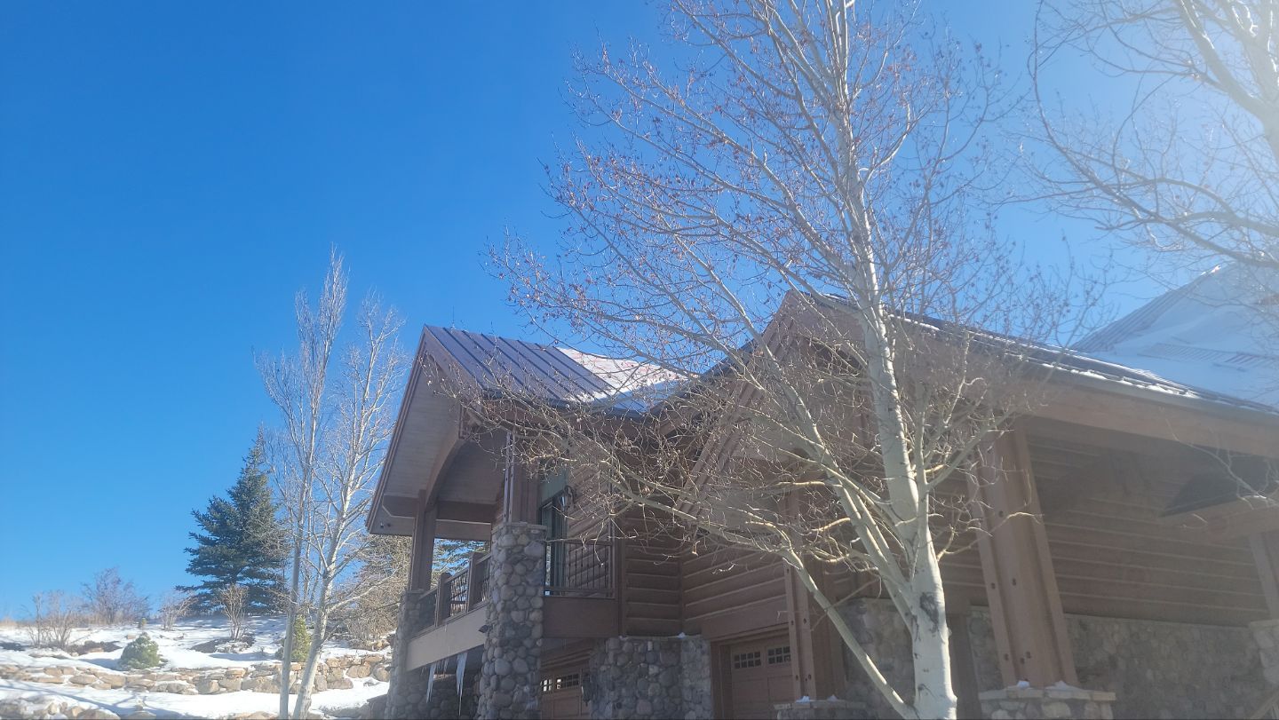 Standing Seam Metal Roof Replacement After Snow Damage by ASAP Roofing & Restoration