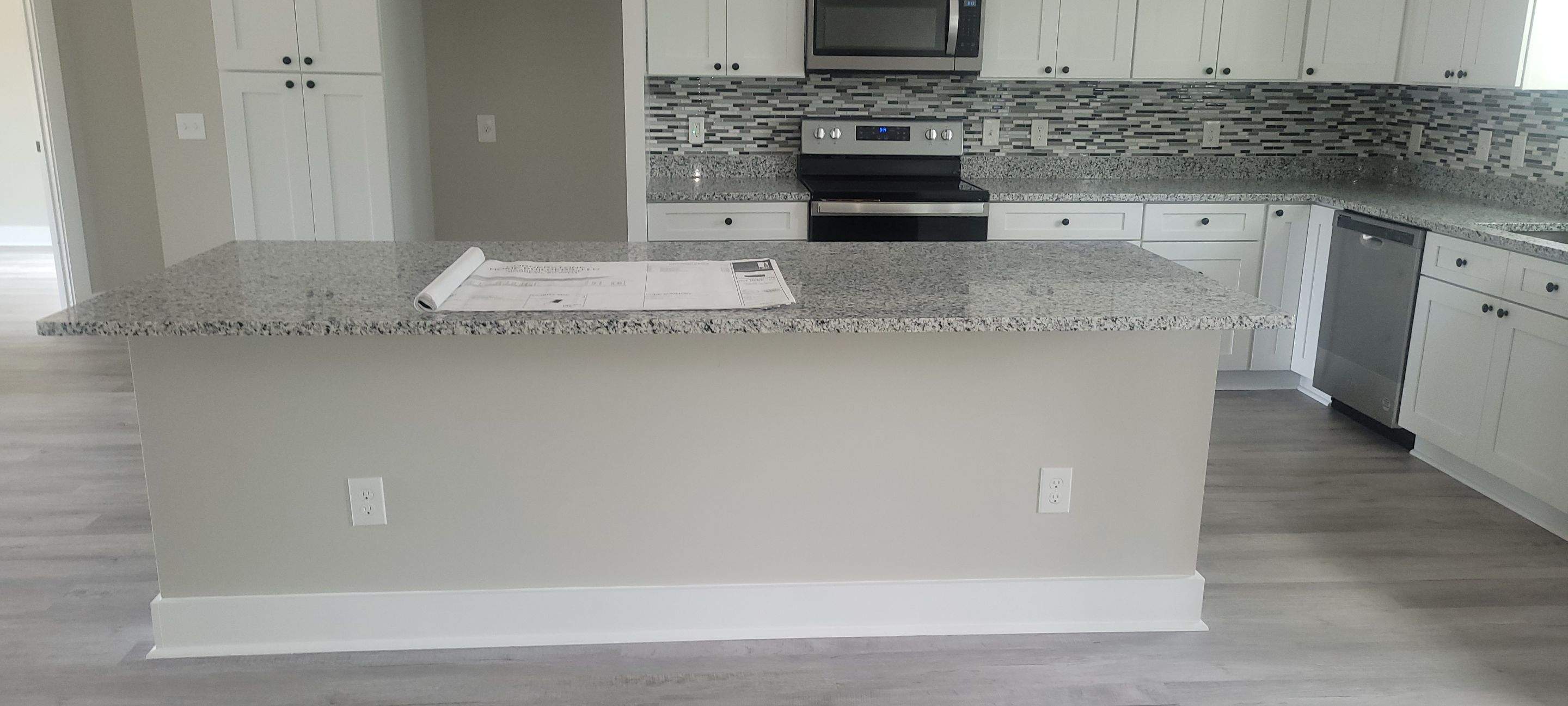 New Home Construction using brick and vertical vinyl by Cornerstone Home Builders, LLC