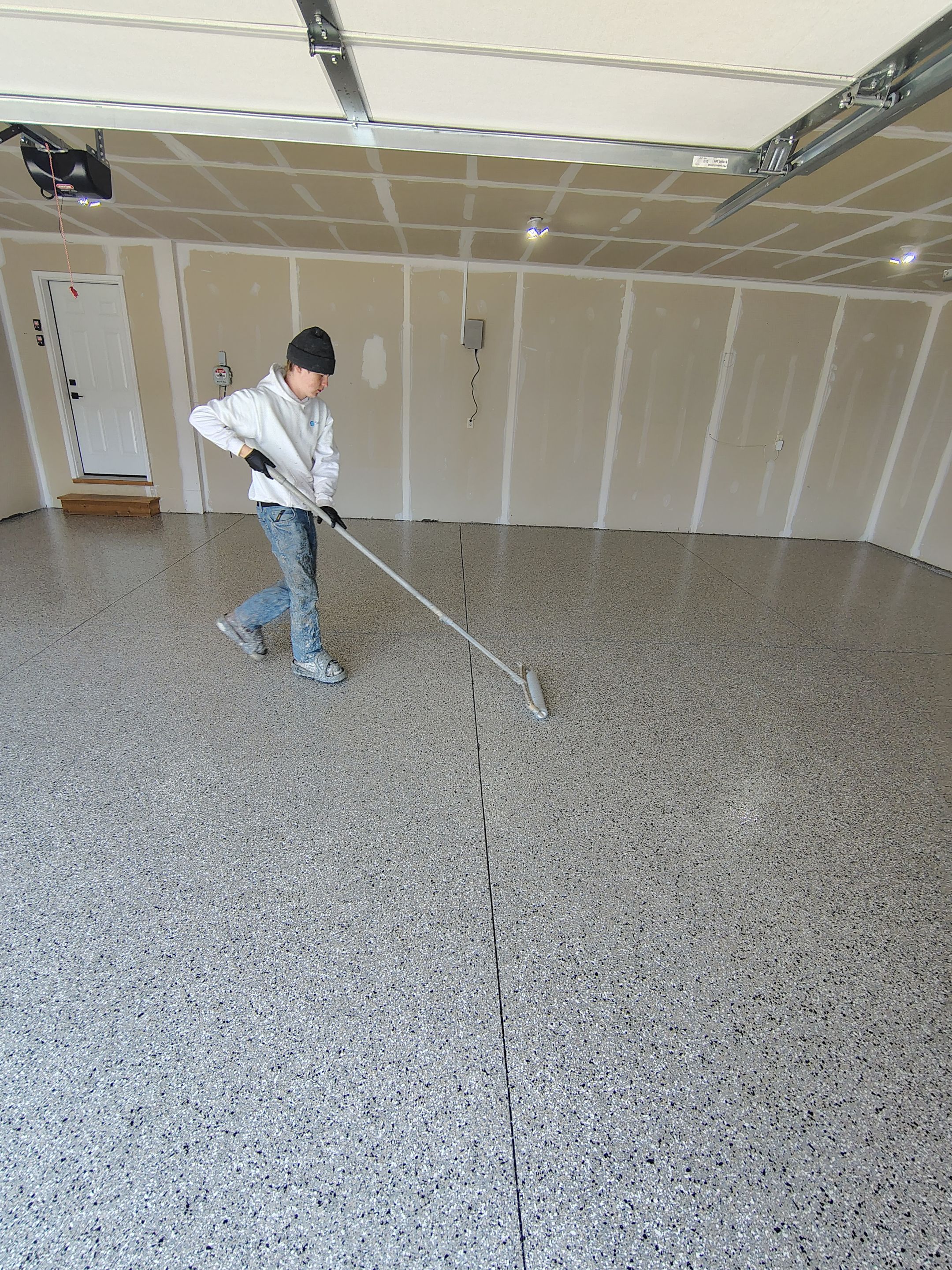 Epoxy Garage Floor Coating with Decorative Flake in Harrisburg by Select Painting, Coatings & Garage Cabinets