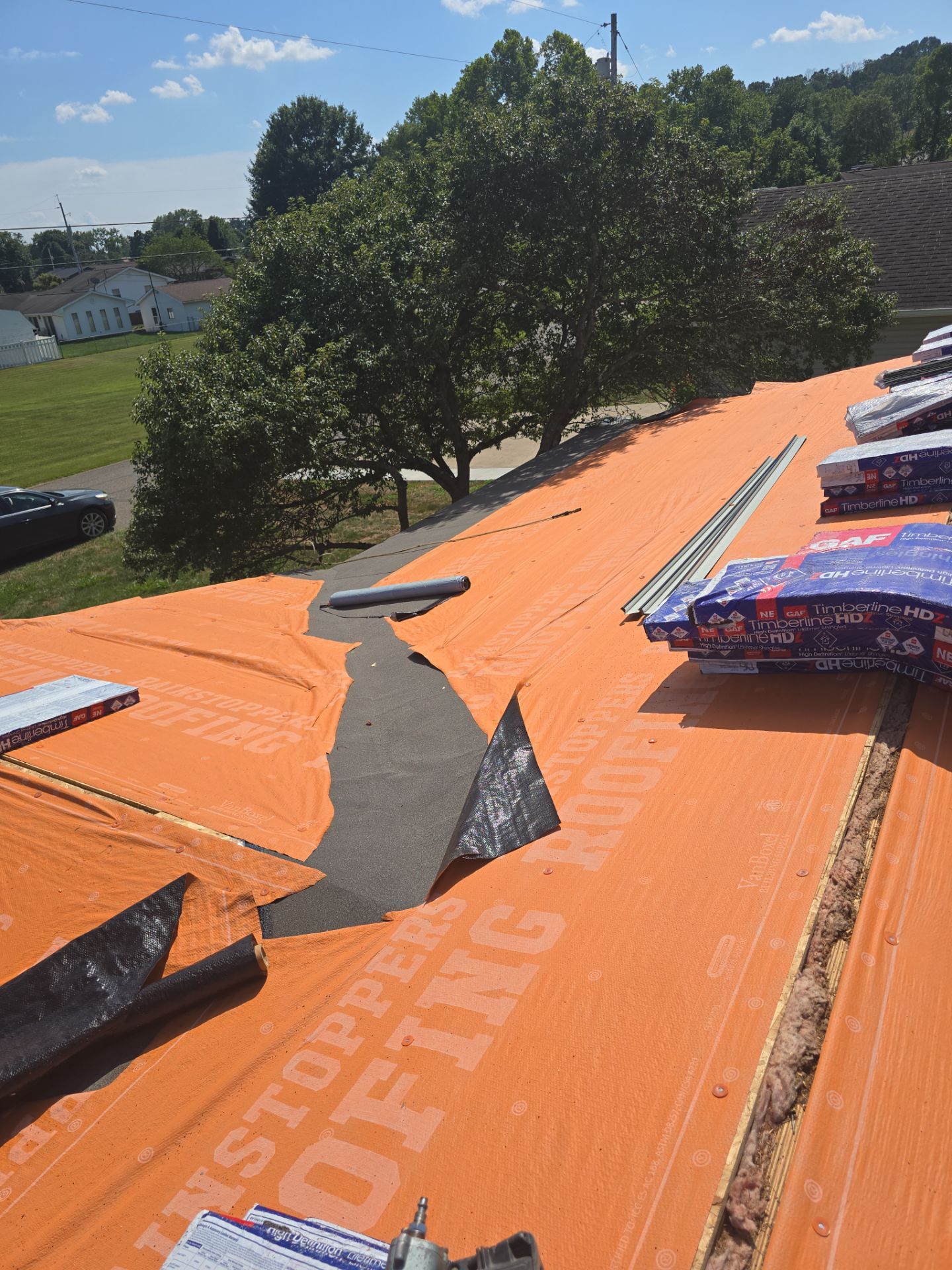 Residential Roofing Installation using GAF Timberline HDZ Charcoal by Rainstoppers Roofing