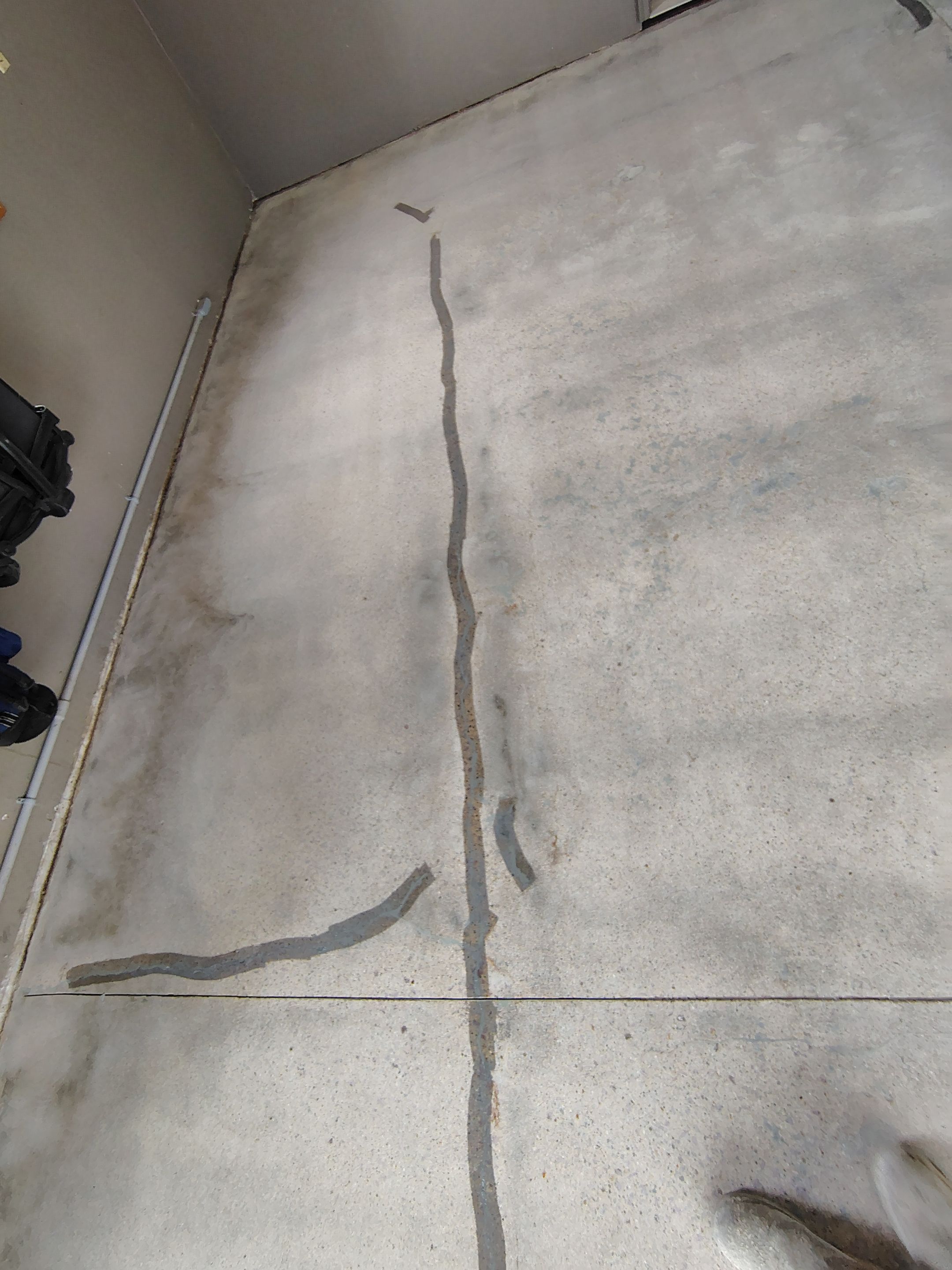 Garage Floor Concrete Coating and Crack Repair in Sioux Falls by Select Painting, Coatings & Garage Cabinets