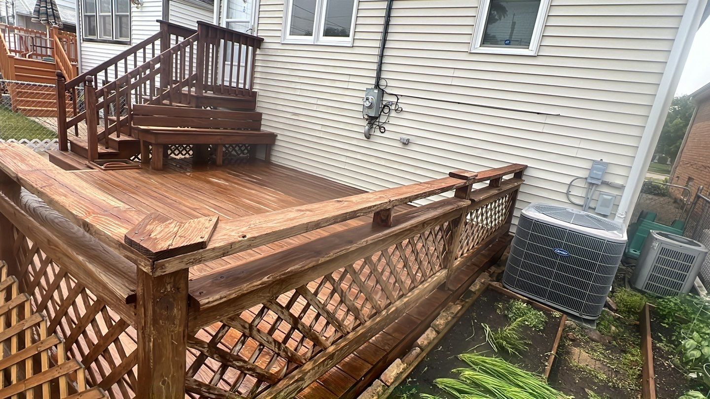 Wood cleaning and staining using Armstrong cloark oil stain by Northern Power Washing LLC.