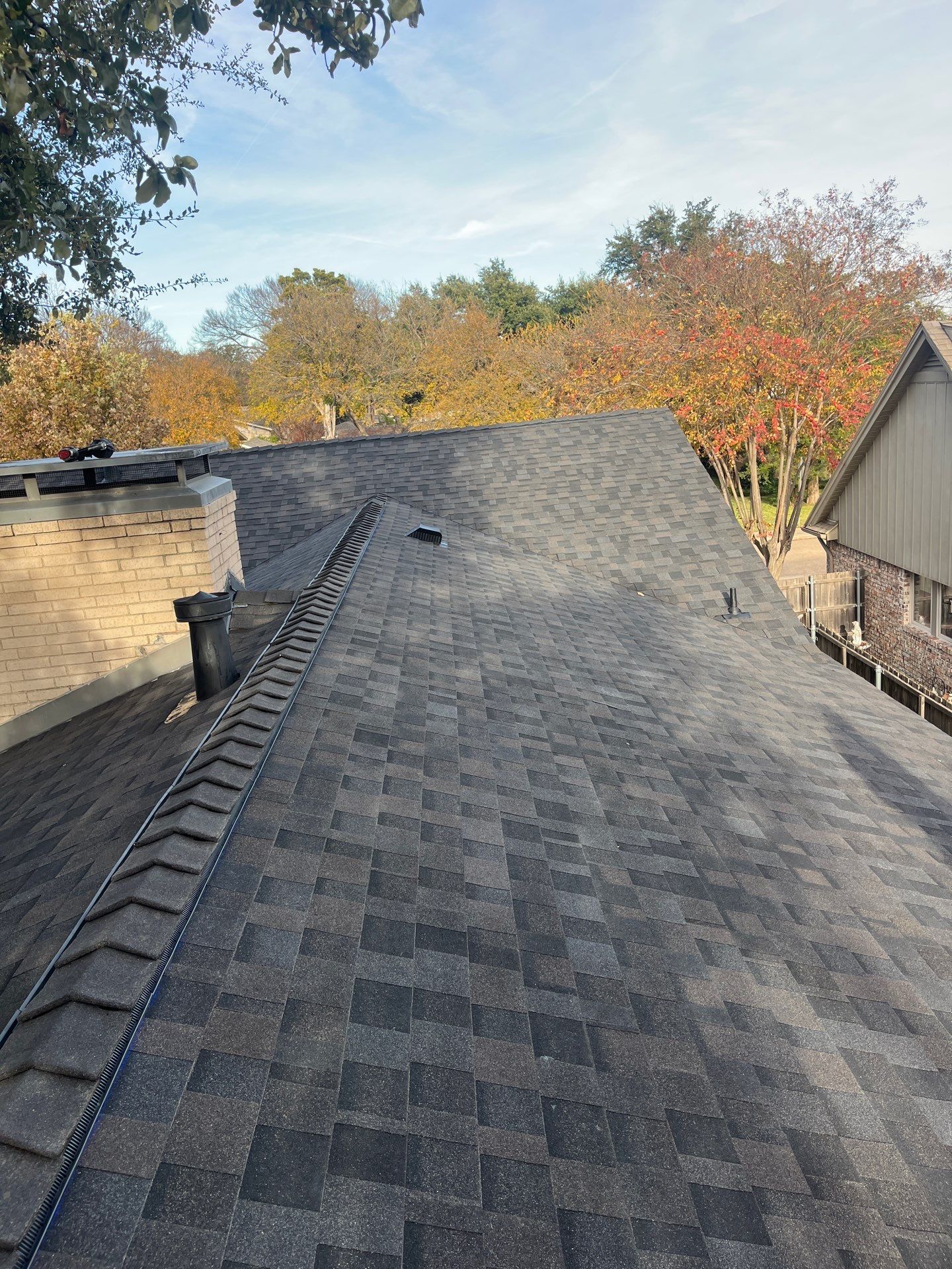 IKO Brownstone- White Brick  by Tejas Roofworks + Restoration