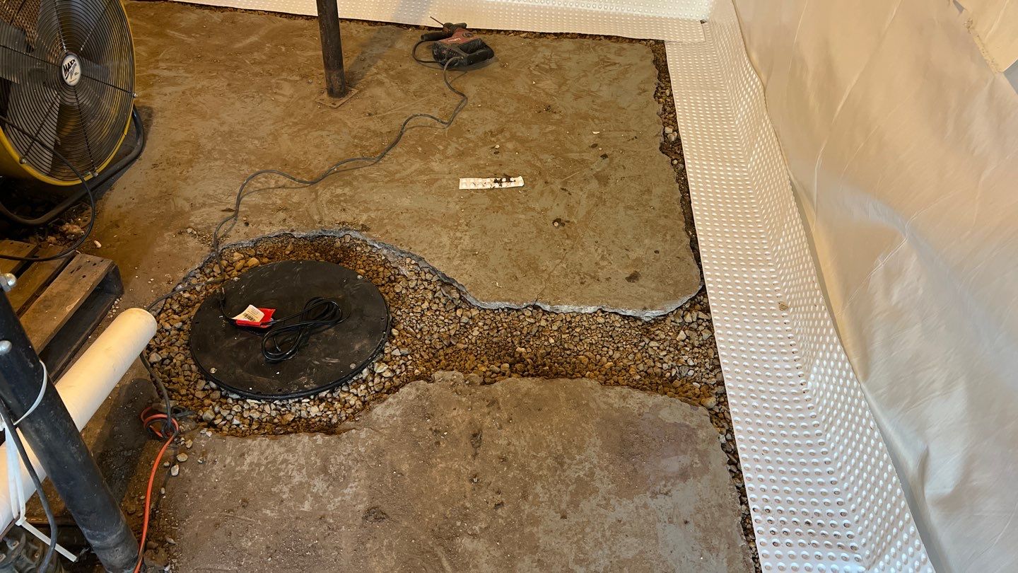 Basement Waterproofing using Drain tile system and a foundation wrap by ACE Waterproofing & Basement Solutions