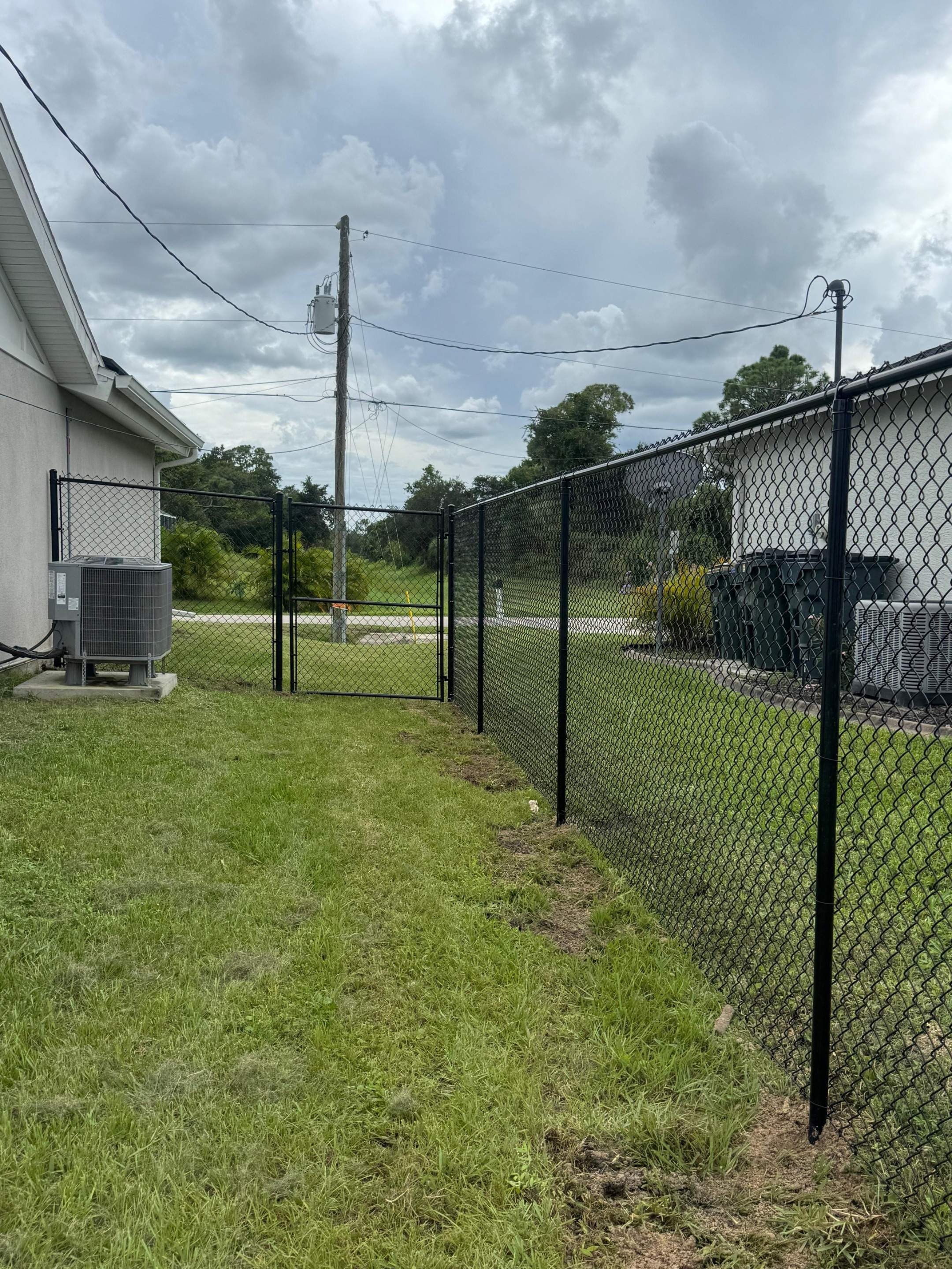 Residential Black Chain Link Fence Installation in North Port by True Fence LLC