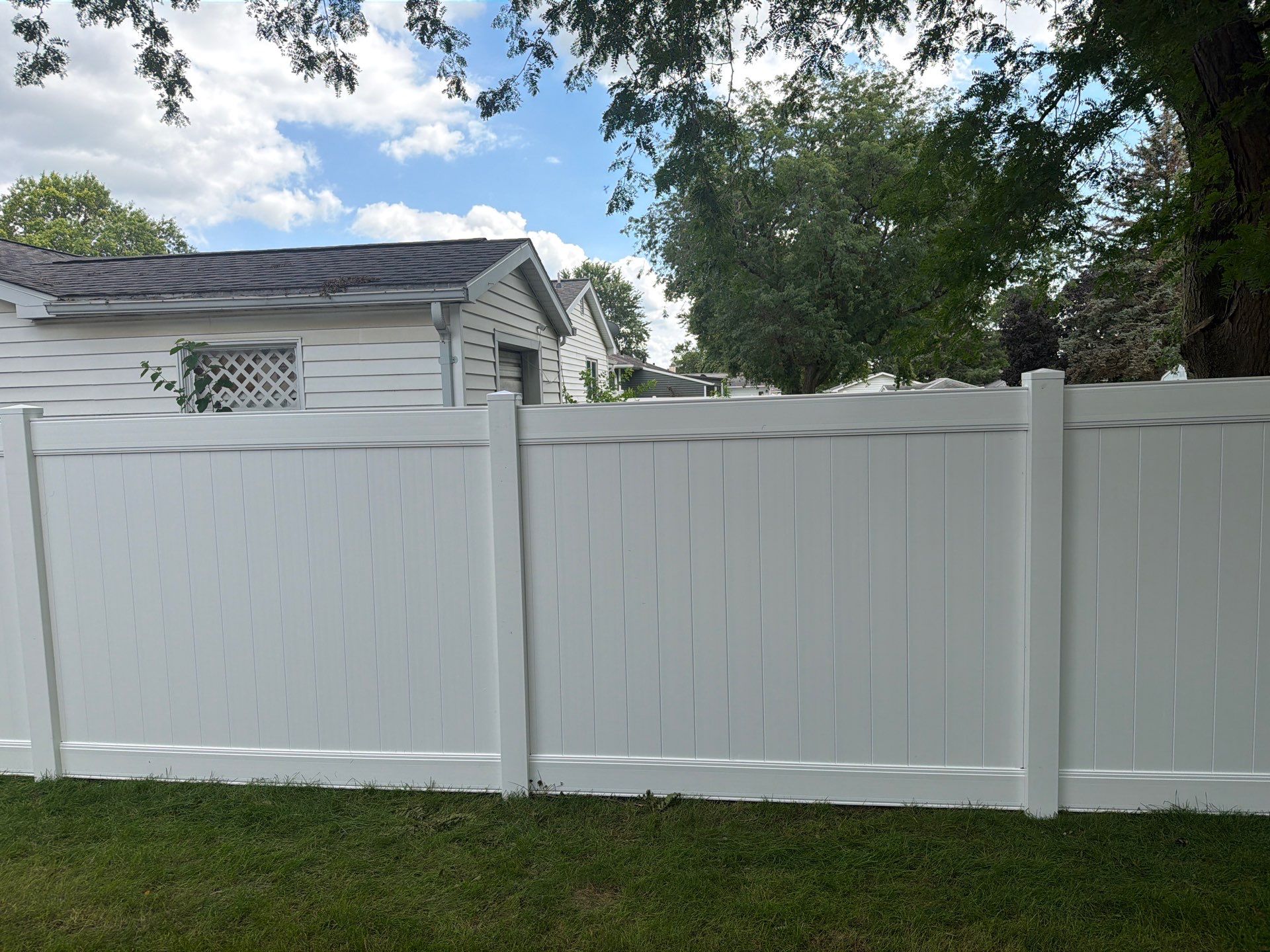 Residential White Vinyl Privacy and Black Chain Link Fencing in Jesup by Perfect Picket Fence and Stain