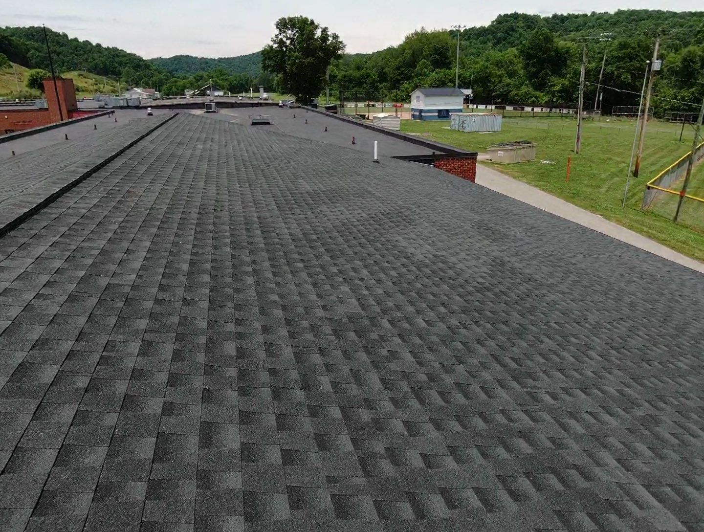 Commercial Roofing Installation using Performance Shingles by Mr. Roofer
