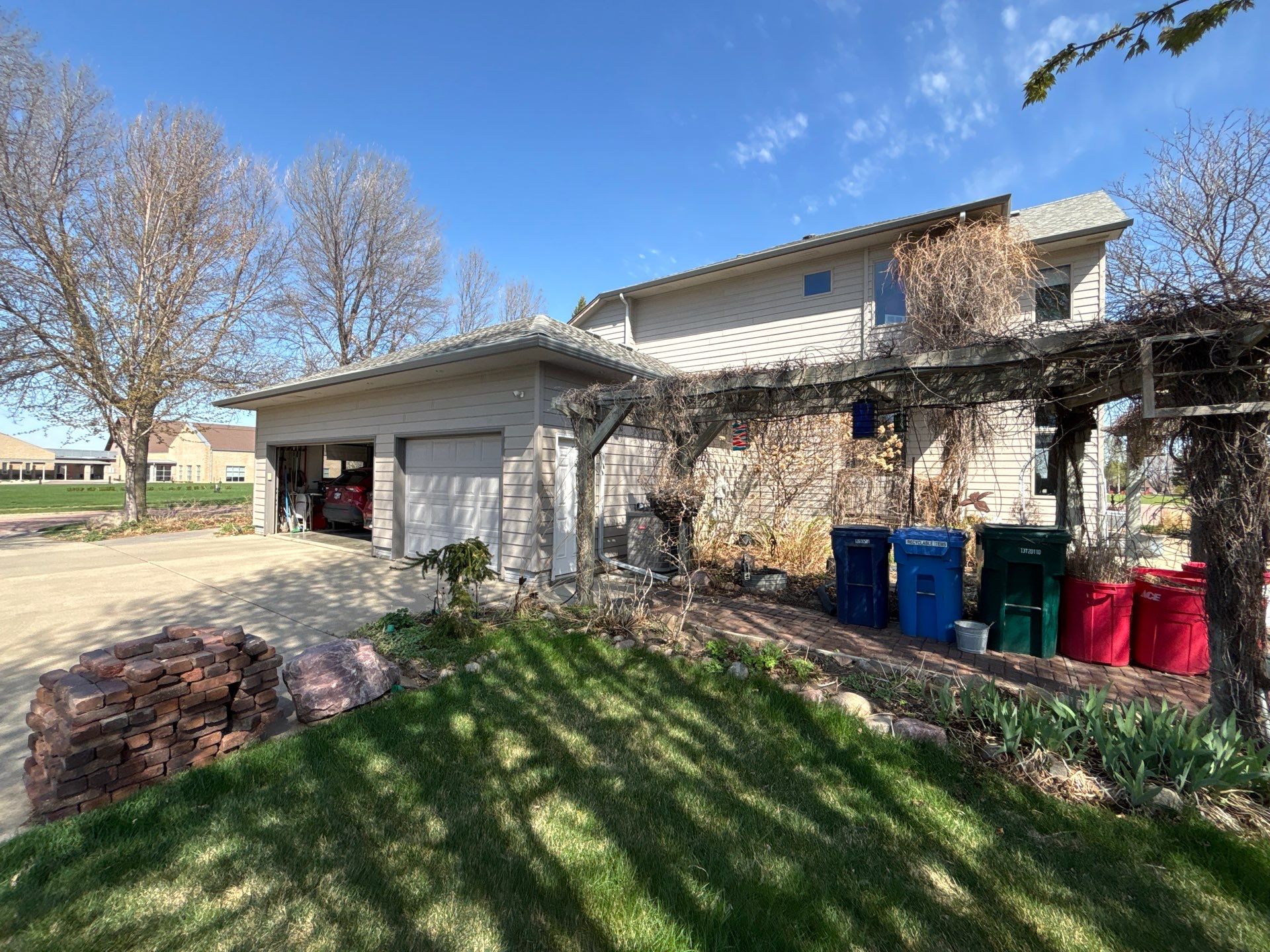 Exterior Siding and Trim Painting for Sioux Falls Residence by Select Painting, Coatings & Garage Cabinets