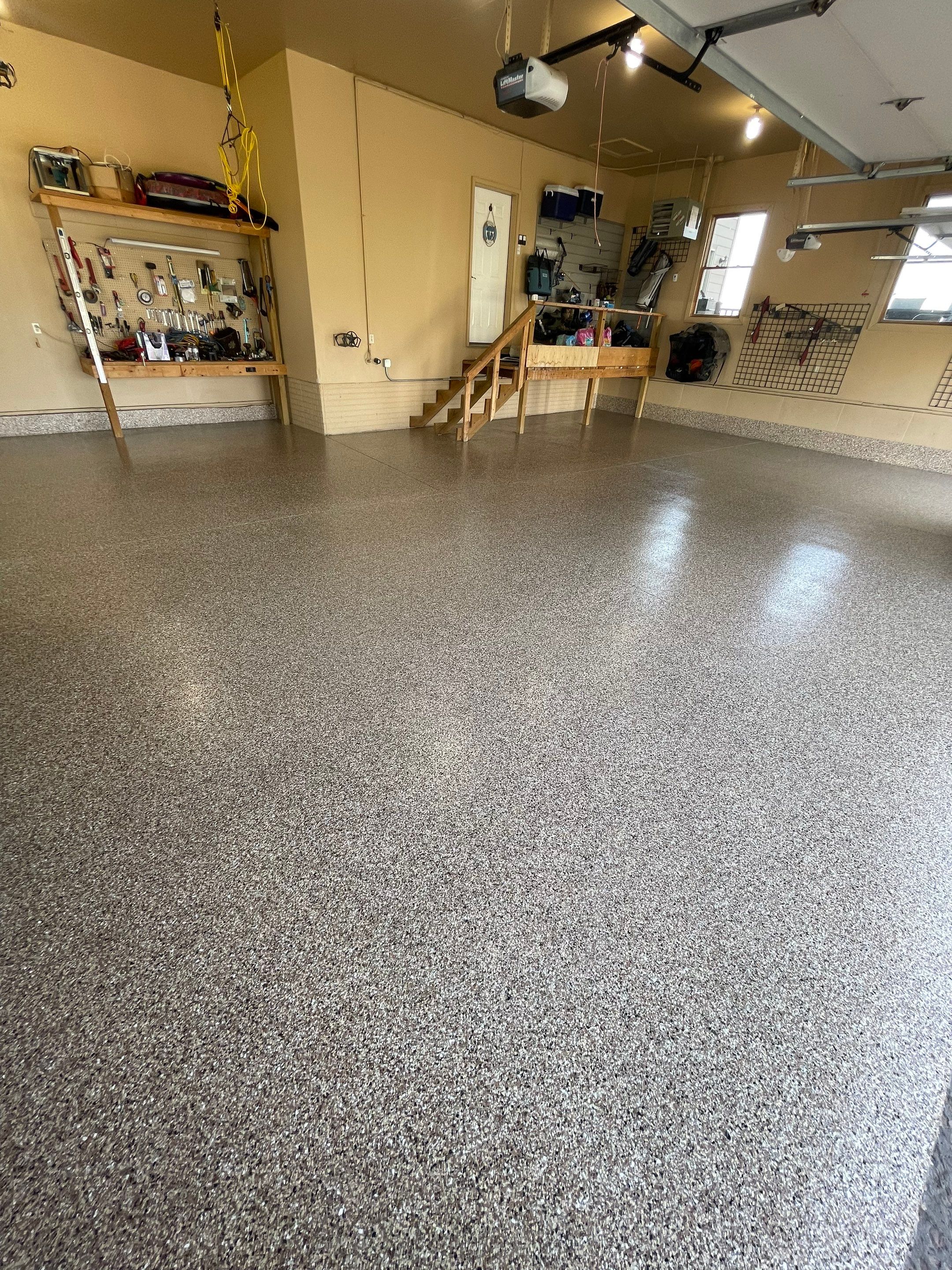 Residential Garage Floor Transformation with Speckled Epoxy Coating by Select Painting, Coatings & Garage Cabinets