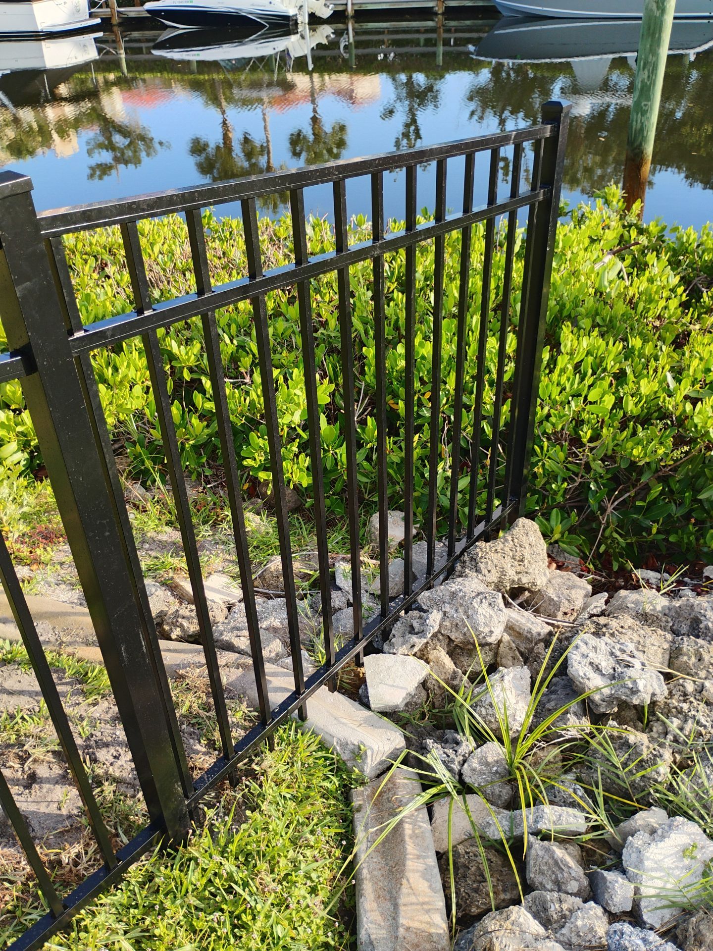 Black Aluminum Waterfront Fence Installation in Osprey by True Fence LLC