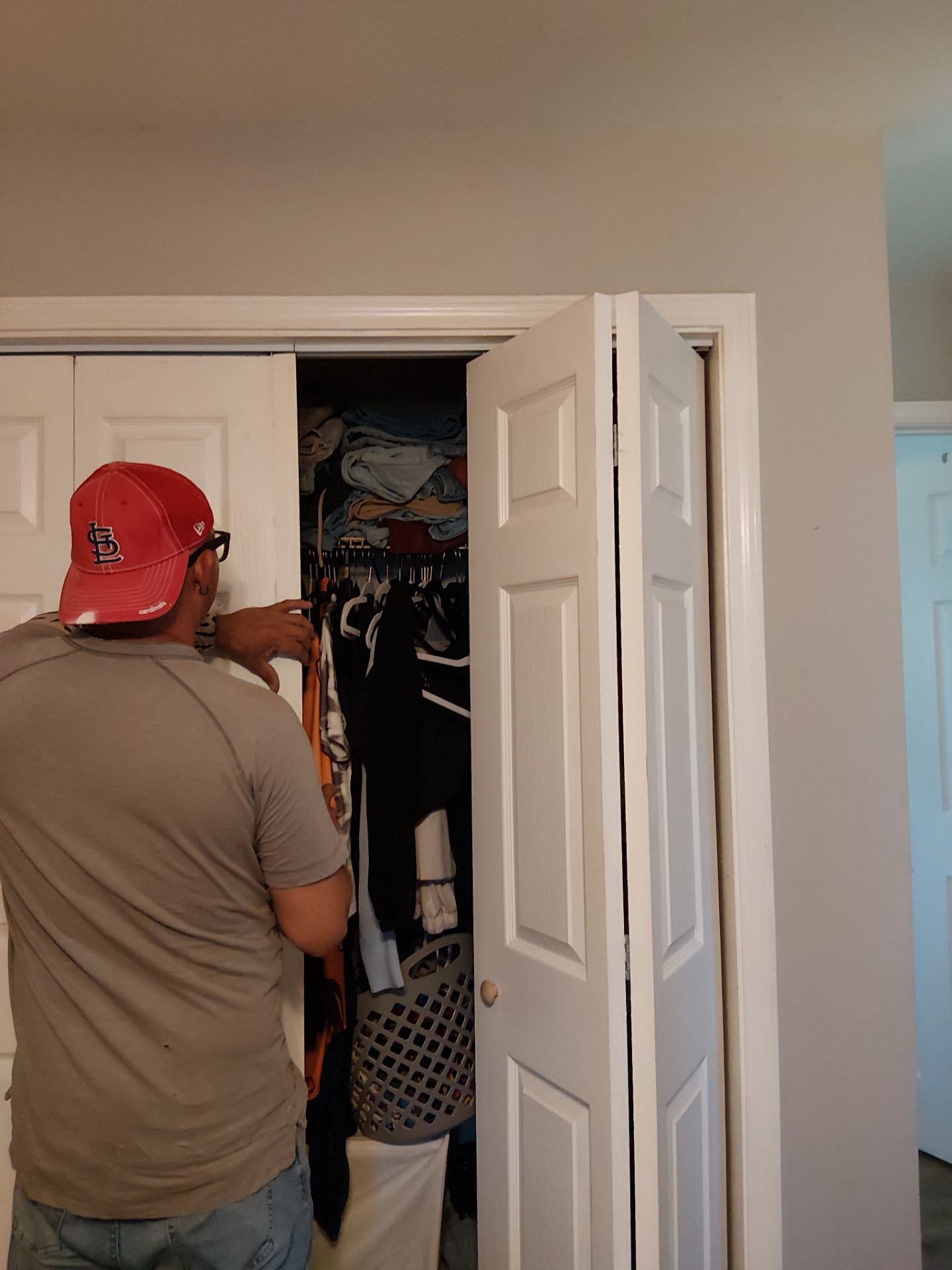 White Paneled Bifold Closet Door Installation by Legendary Services Company LLC.