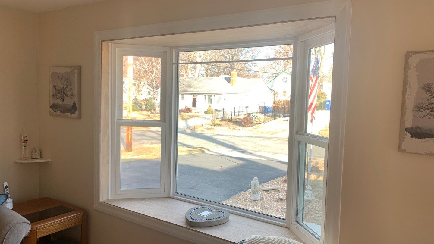 Window Installation with a Heartland Bay Window by EEC  Windows, Siding & Roofing 