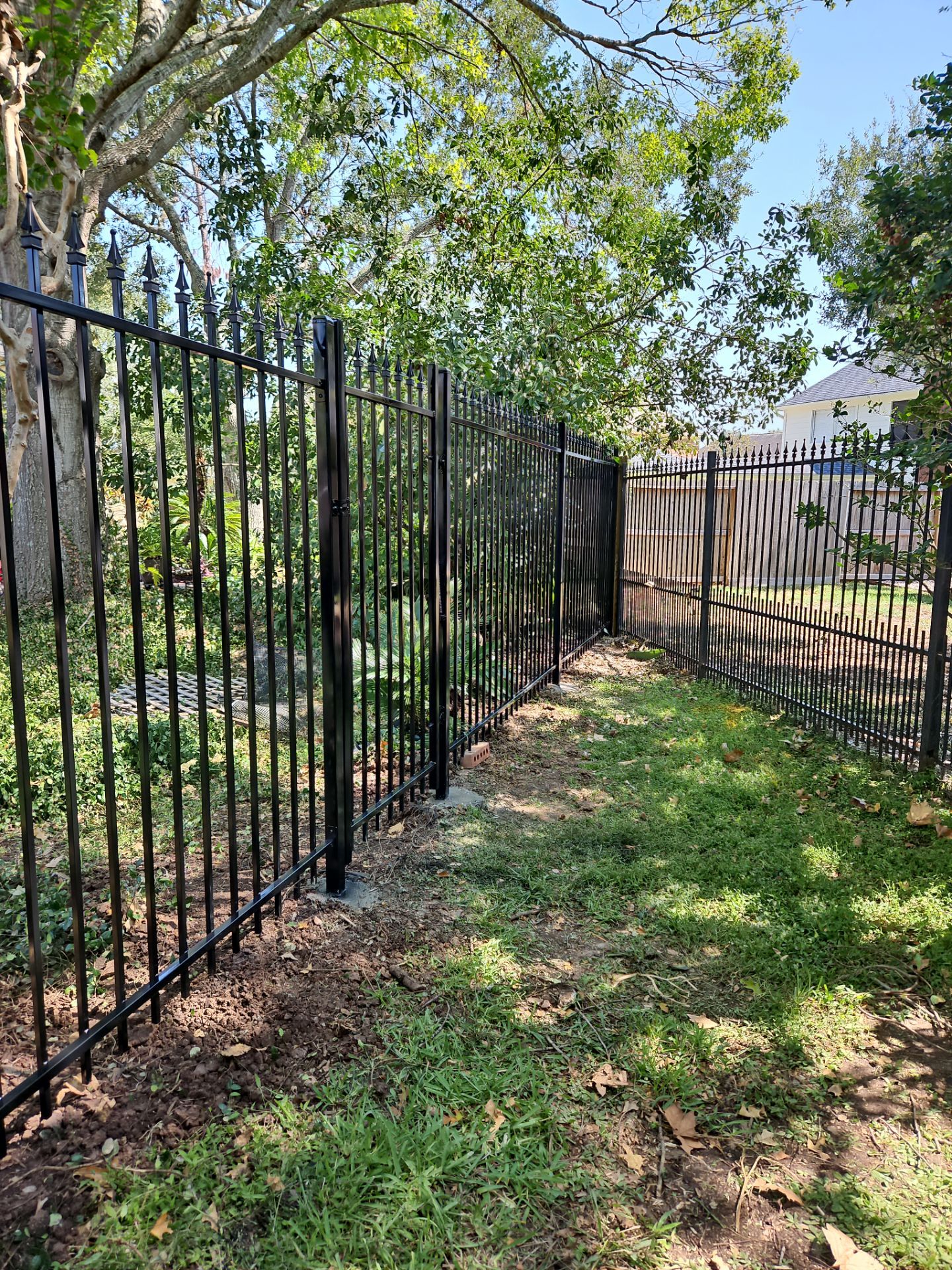 Iron fence installation using LION iron panel - 2 Rail, 6ft Tall by Tim's Fences