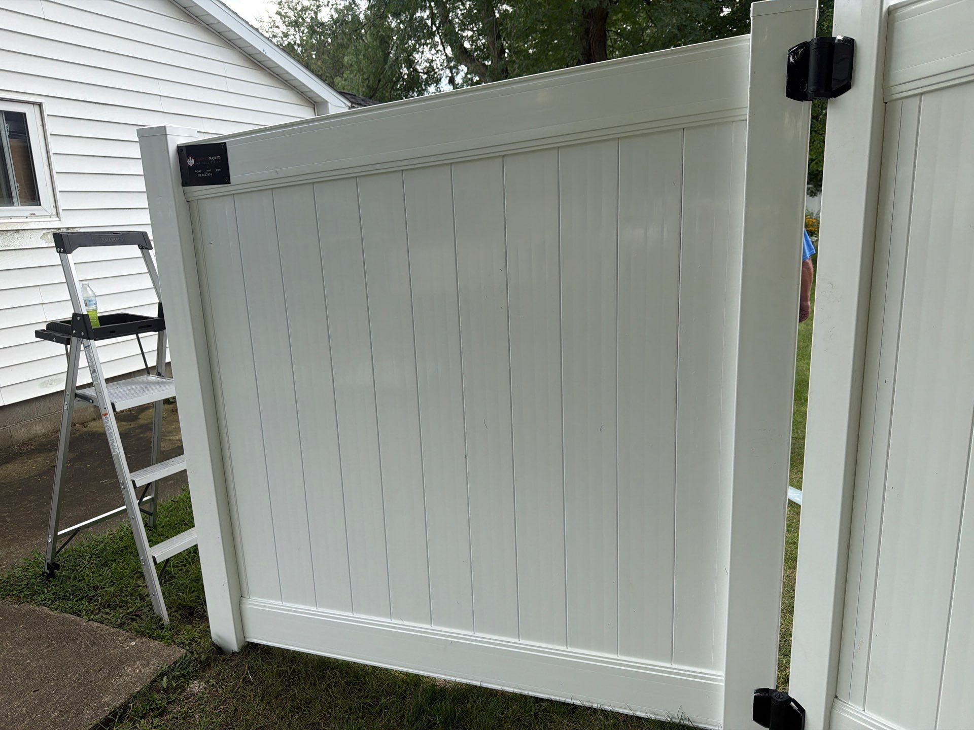 Residential White Vinyl Privacy and Black Chain Link Fencing in Jesup by Perfect Picket Fence and Stain