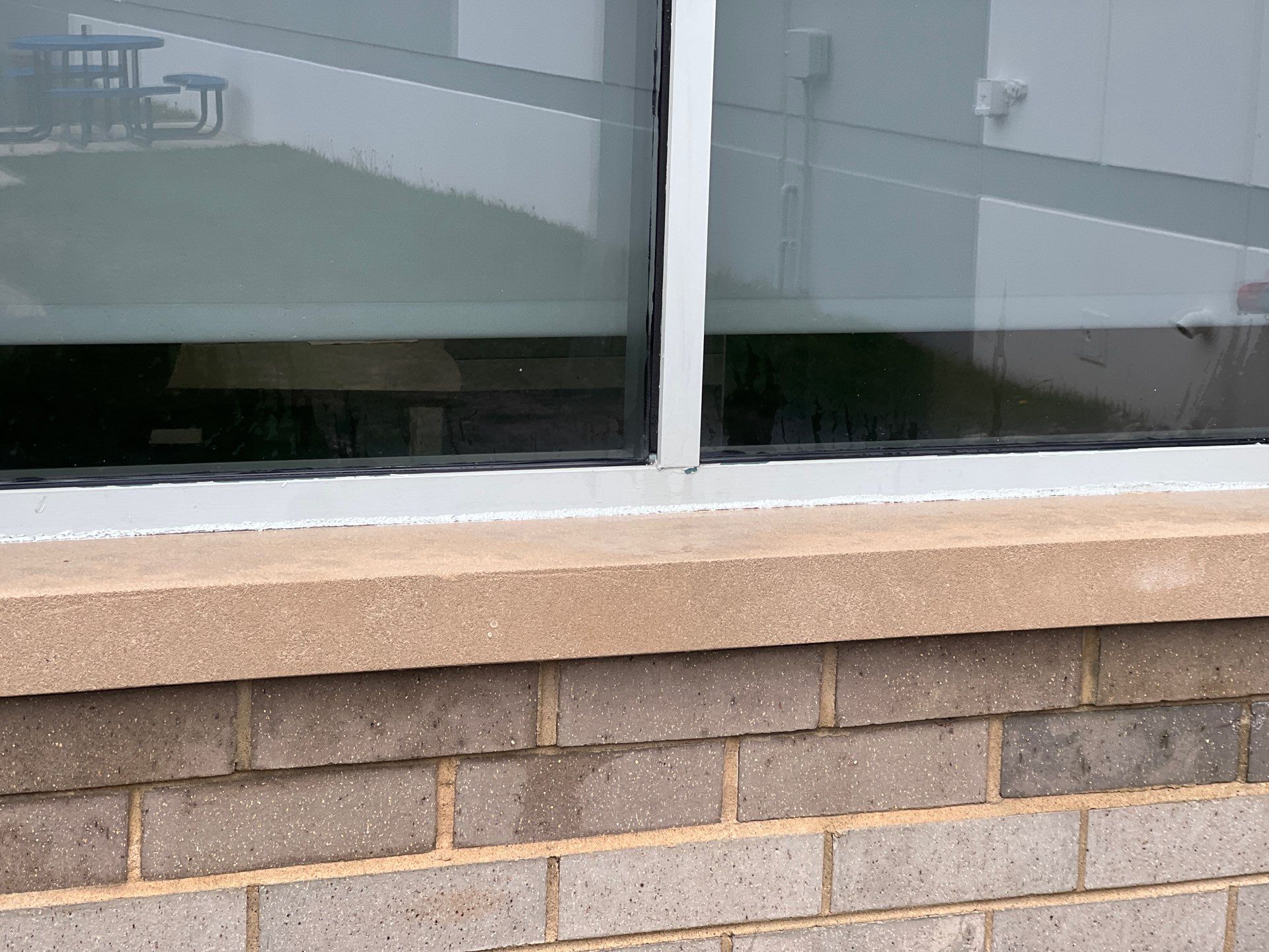 Commercial Facade cleaning using Algaecide, soft wash soap by Northern Power Washing LLC.