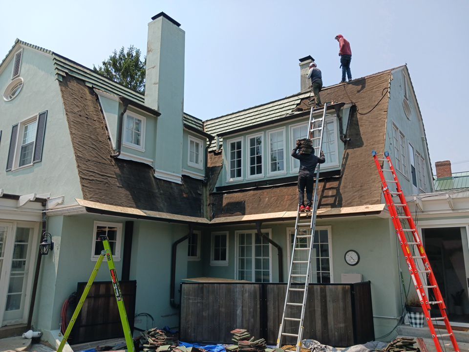Slate removal/Cedar Shake replacement by Storm Contracting 
