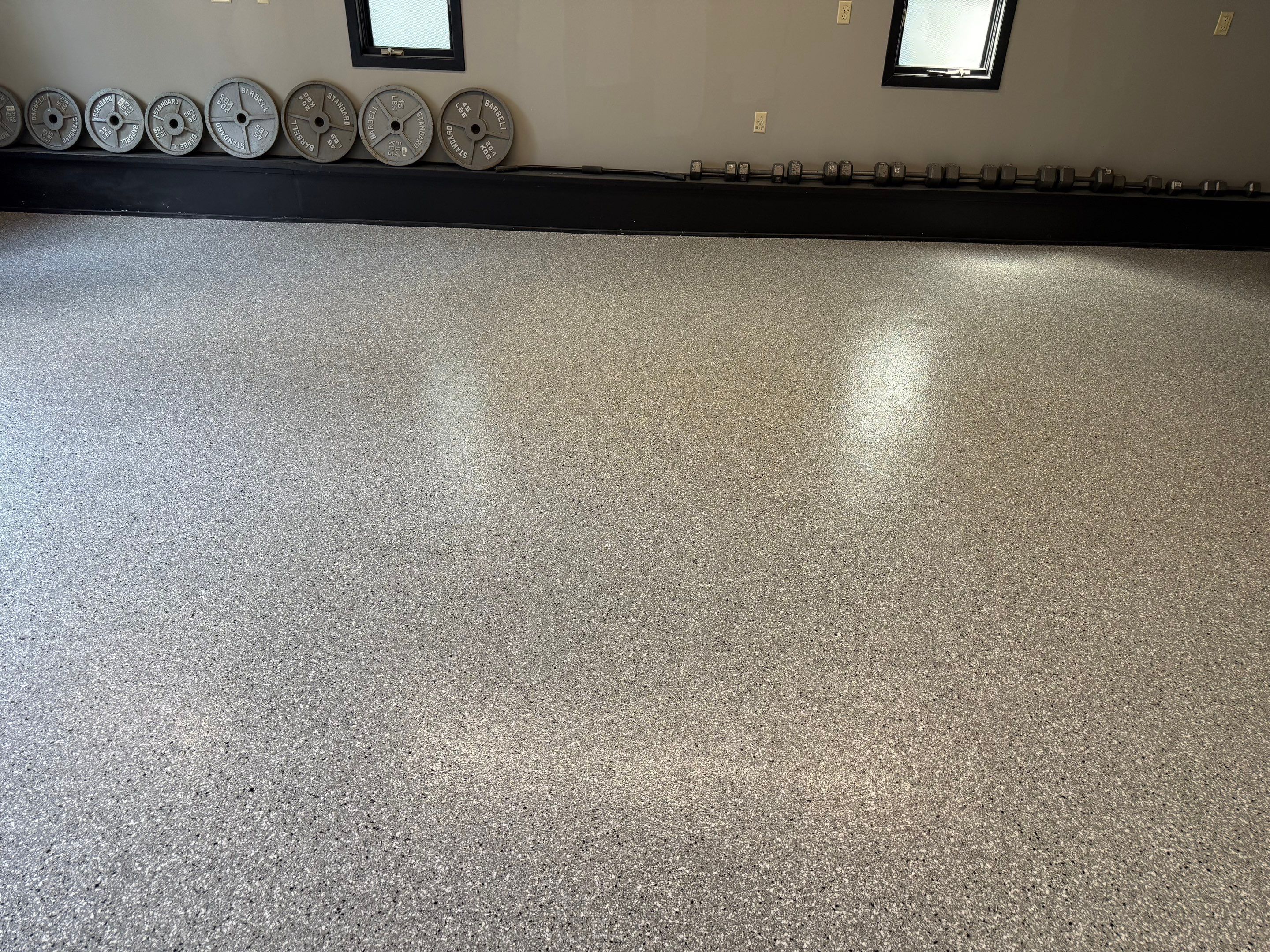 Garage Floor and Textured Pool Deck Coating in Sioux Falls by Select Painting, Coatings & Garage Cabinets
