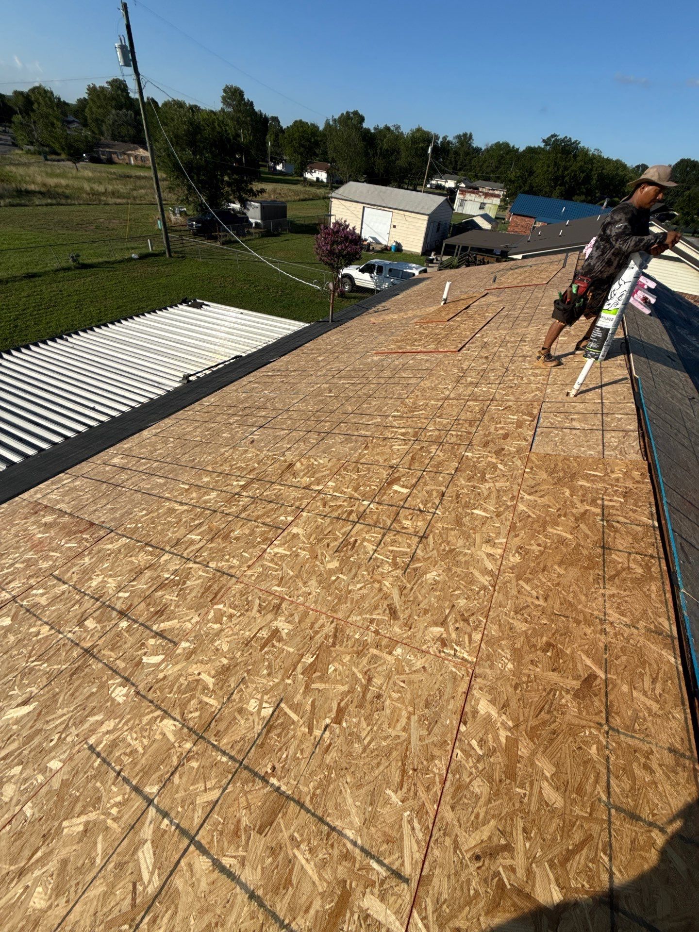New roof & siding paid by insurance. Along with new roof sheathing.  by In & Out Construction & Remodeling, LLC