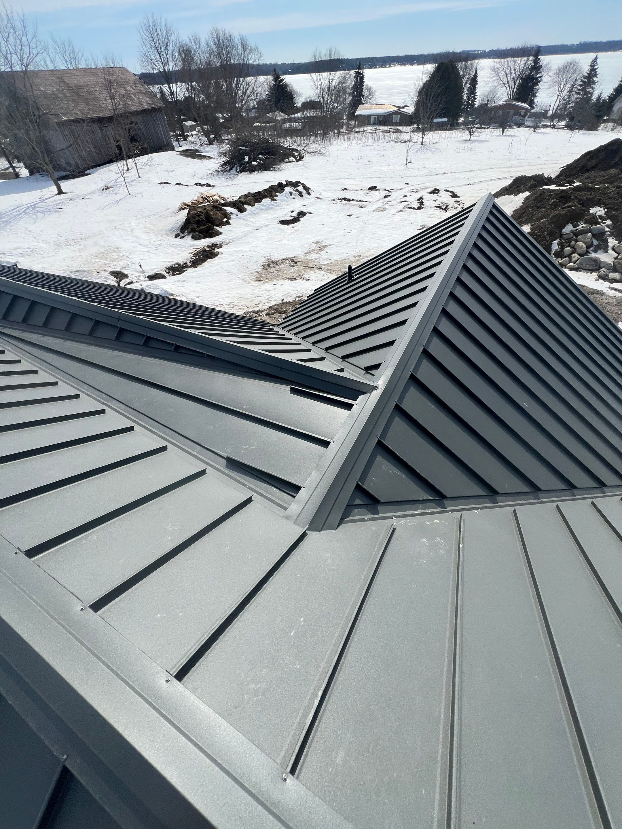 New Home Construction using 16" Standing Seam Panels by Jay Carter Roofing & Sheet Metal