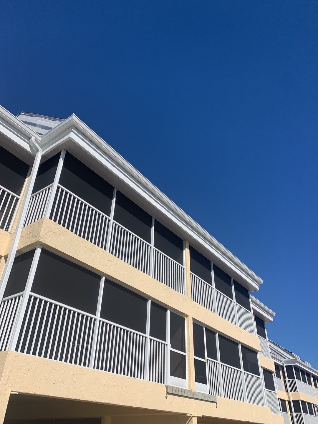 White Seamless Gutters and Downspouts in Sanibel FL by Gutter Professors