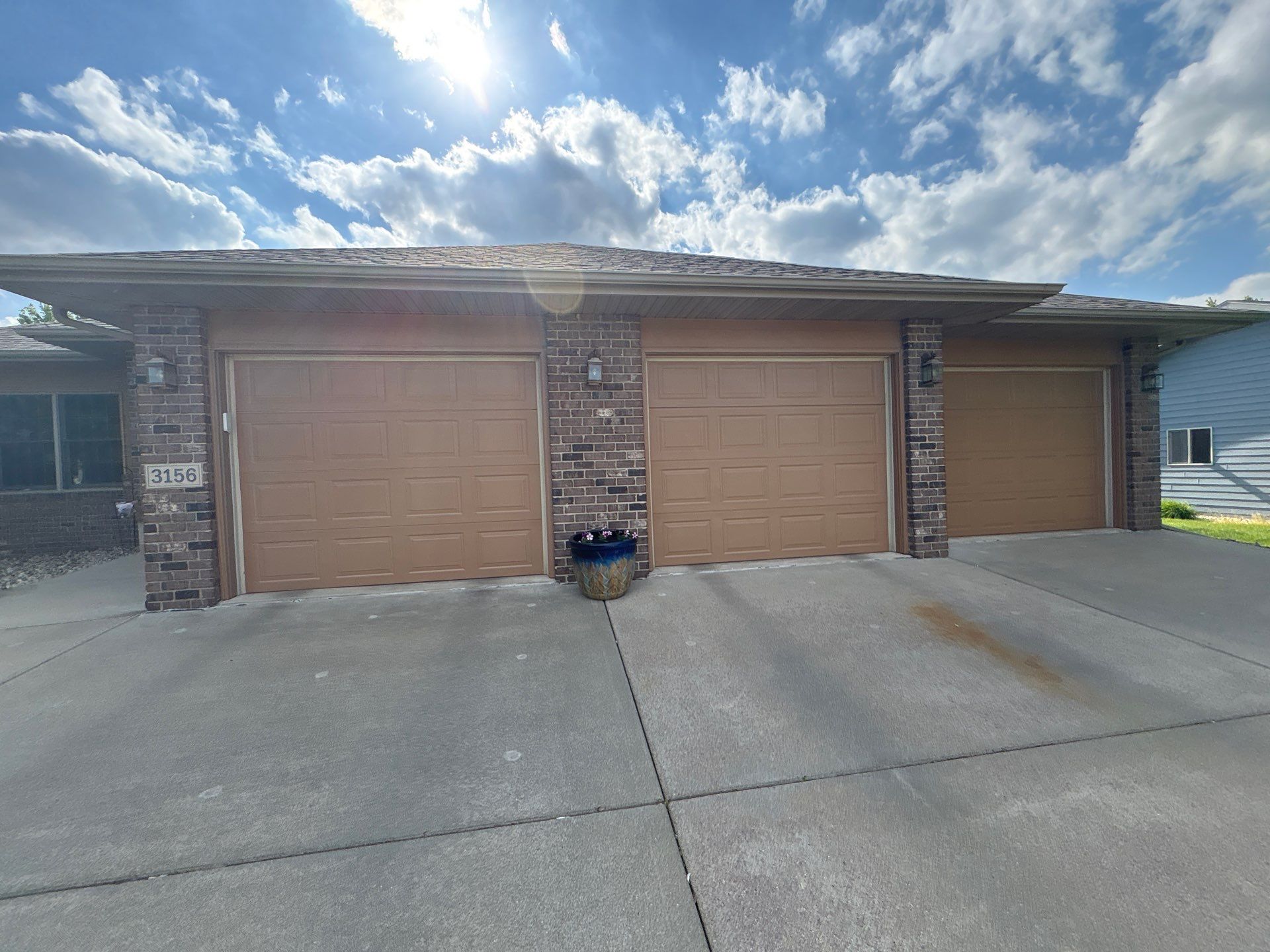 Sioux Falls Residential Exterior Door and Siding Refresh by Select Painting, Coatings & Garage Cabinets
