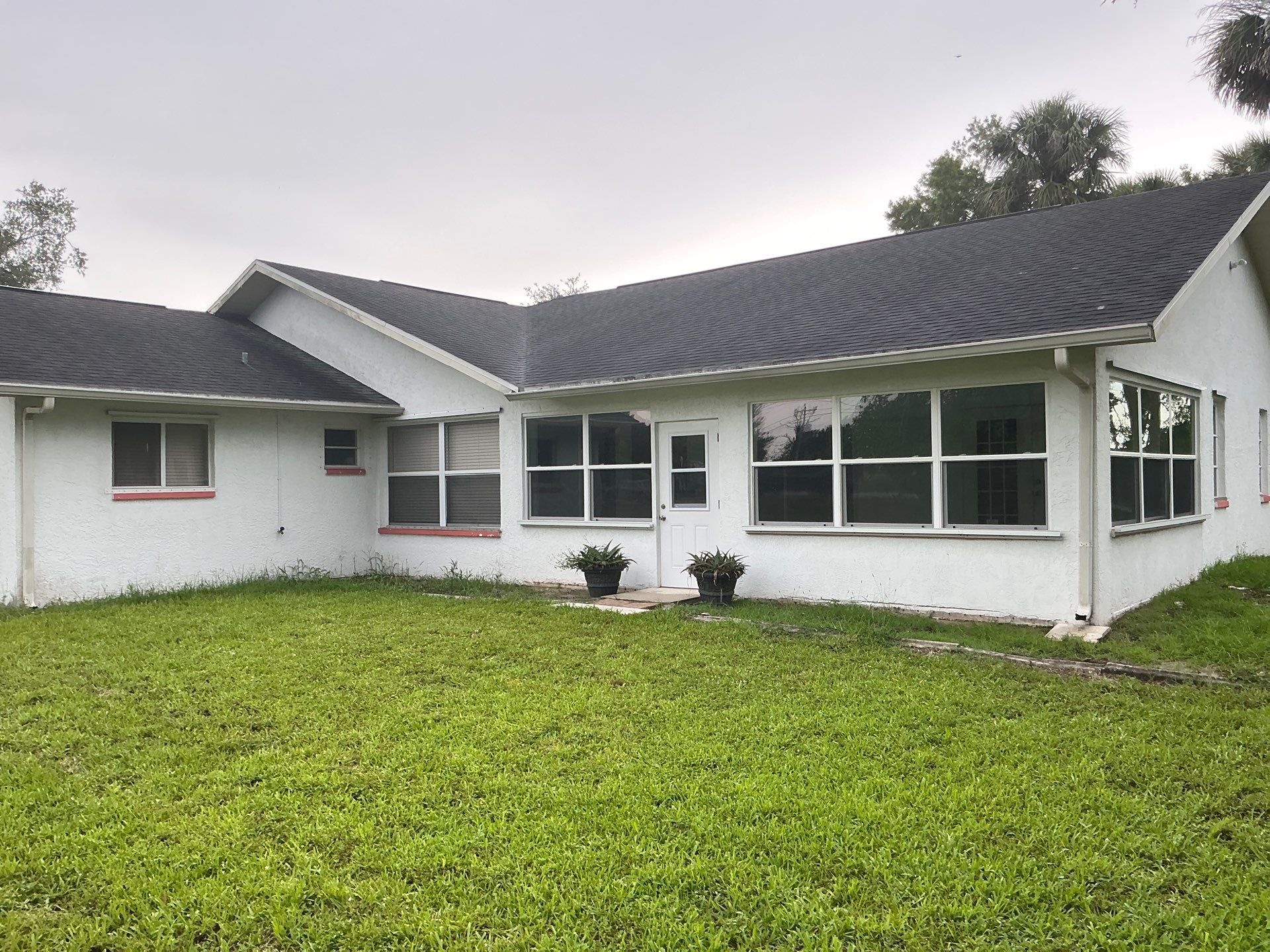 White Seamless Gutters with Splash Guards in North Fort Myers FL by Gutter Professor   by Gutter Professors