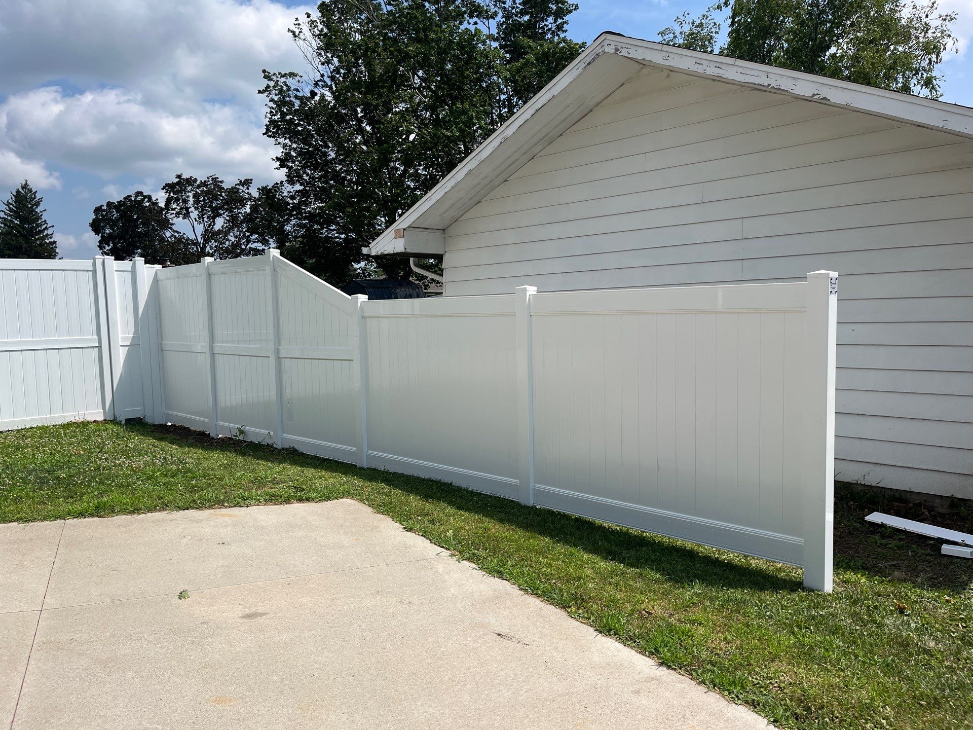 White Vinyl Privacy Fence Installation in Cedar Falls by Perfect Picket Fence and Stain