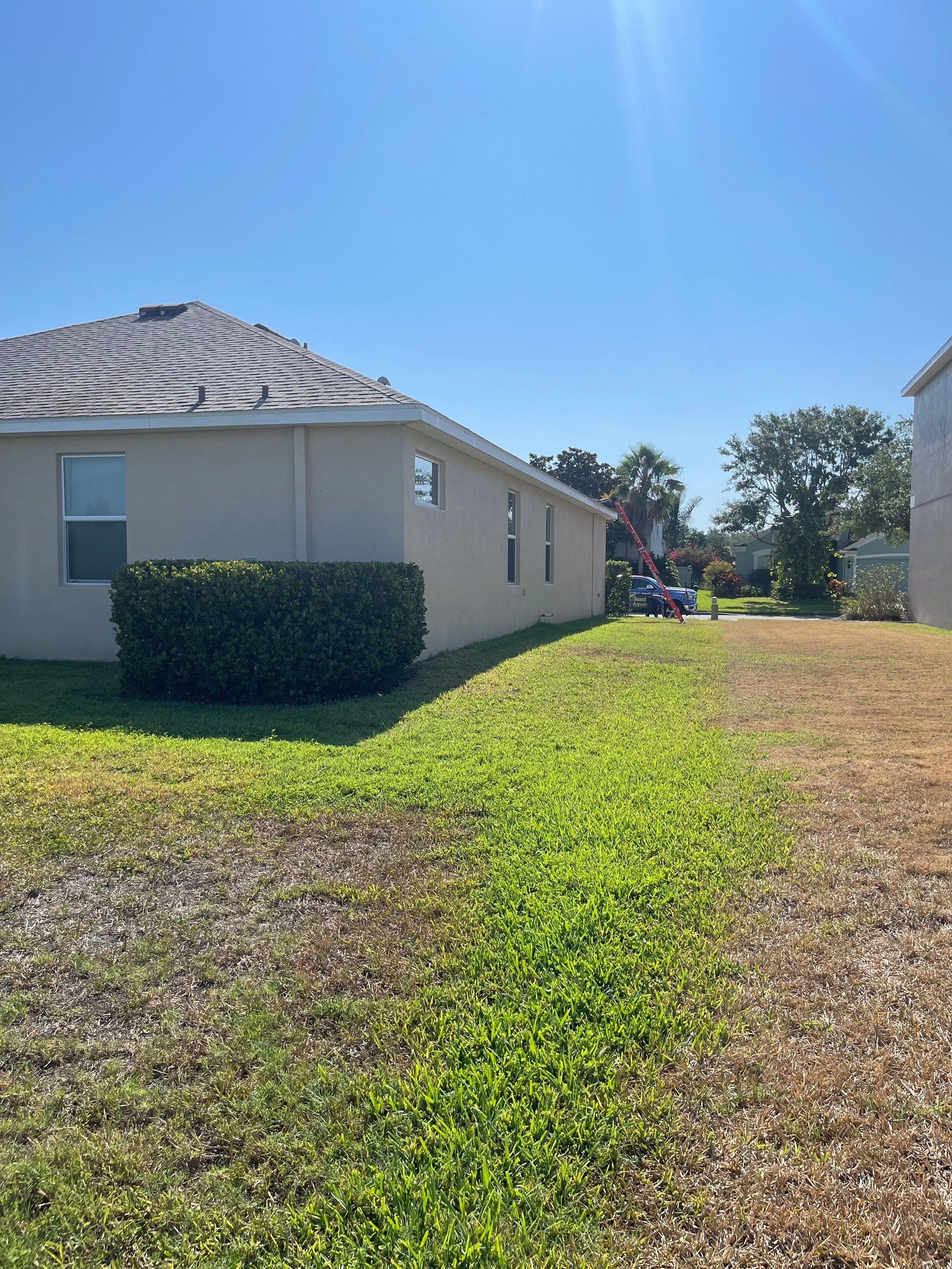 Asphalt Shingle Roof Soft Wash Cleaning & Concrete Pressure Washing in CopperStone Community, Parrish, FL by Sunshine AquaWash