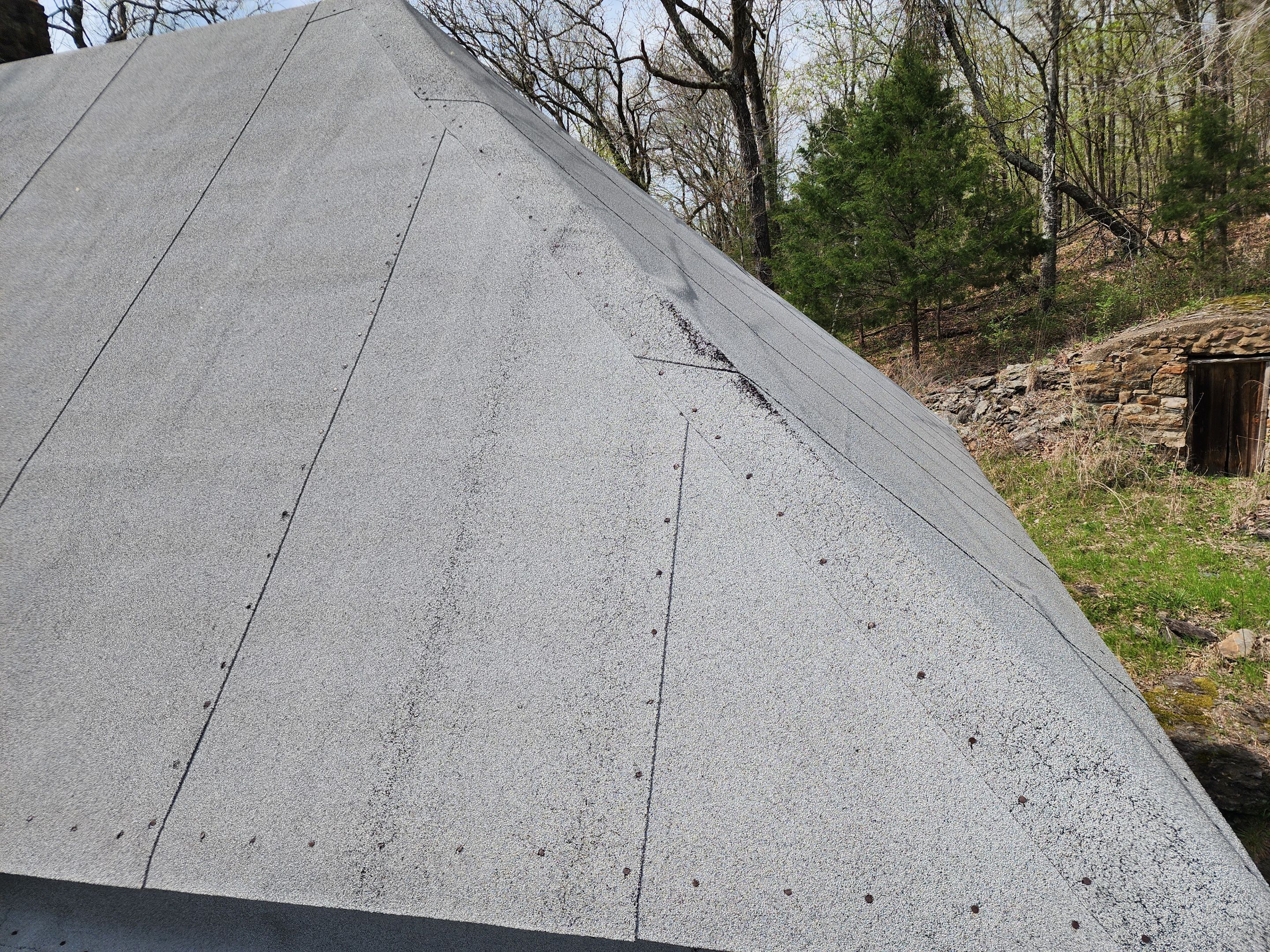 Residential Roofing Installation using 26 Gauge Colored Panels by Hostetler Roofing