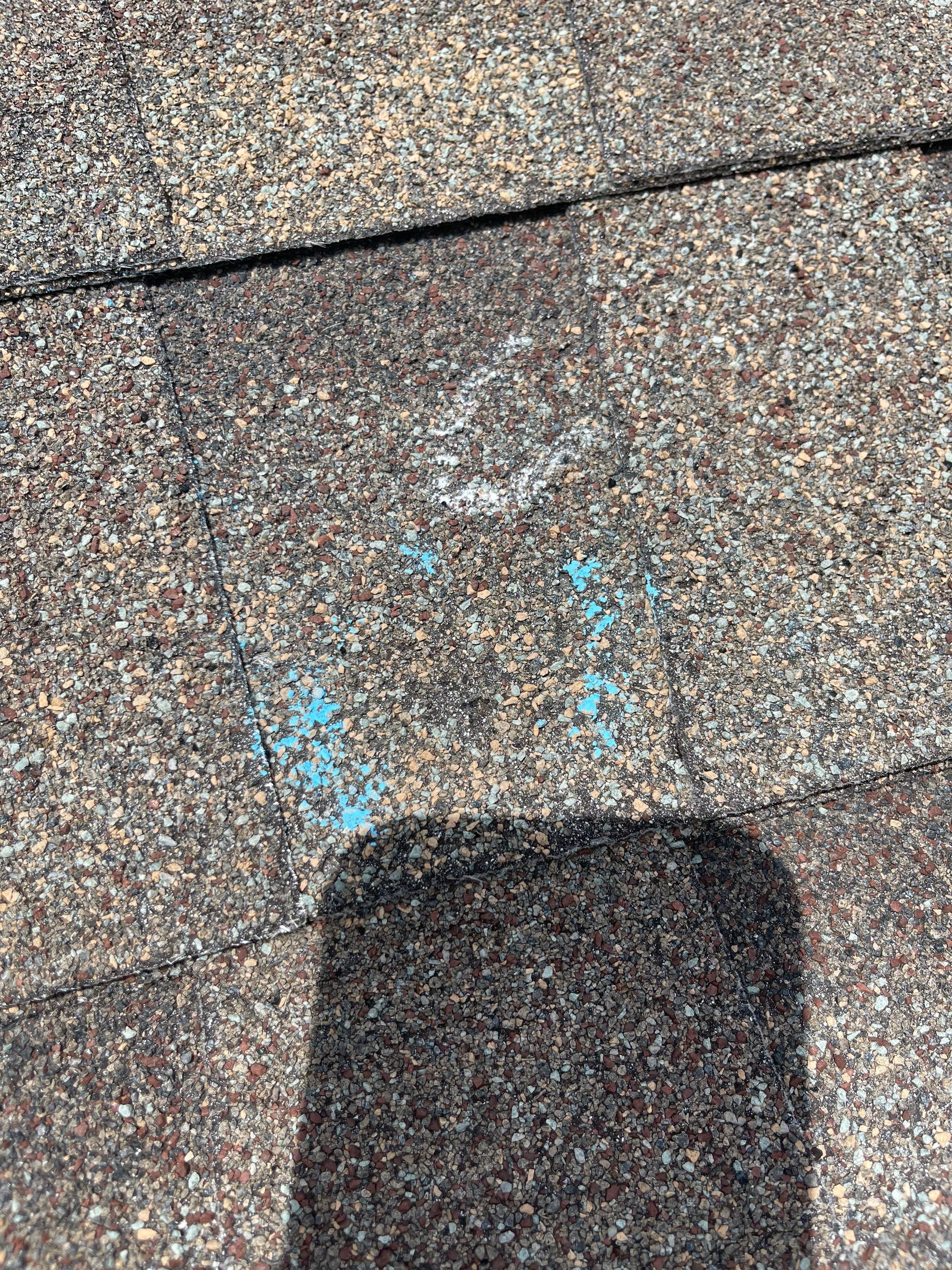 Hail Damage on a Roofing System by Icon Roofing And Construction 