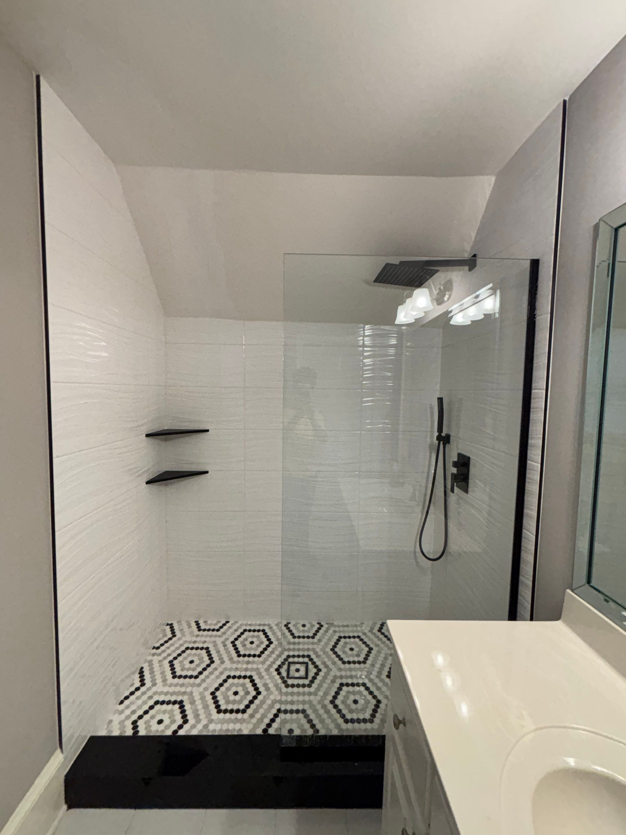 Tub to walk-in shower conversion using Glass door by Prudencio
