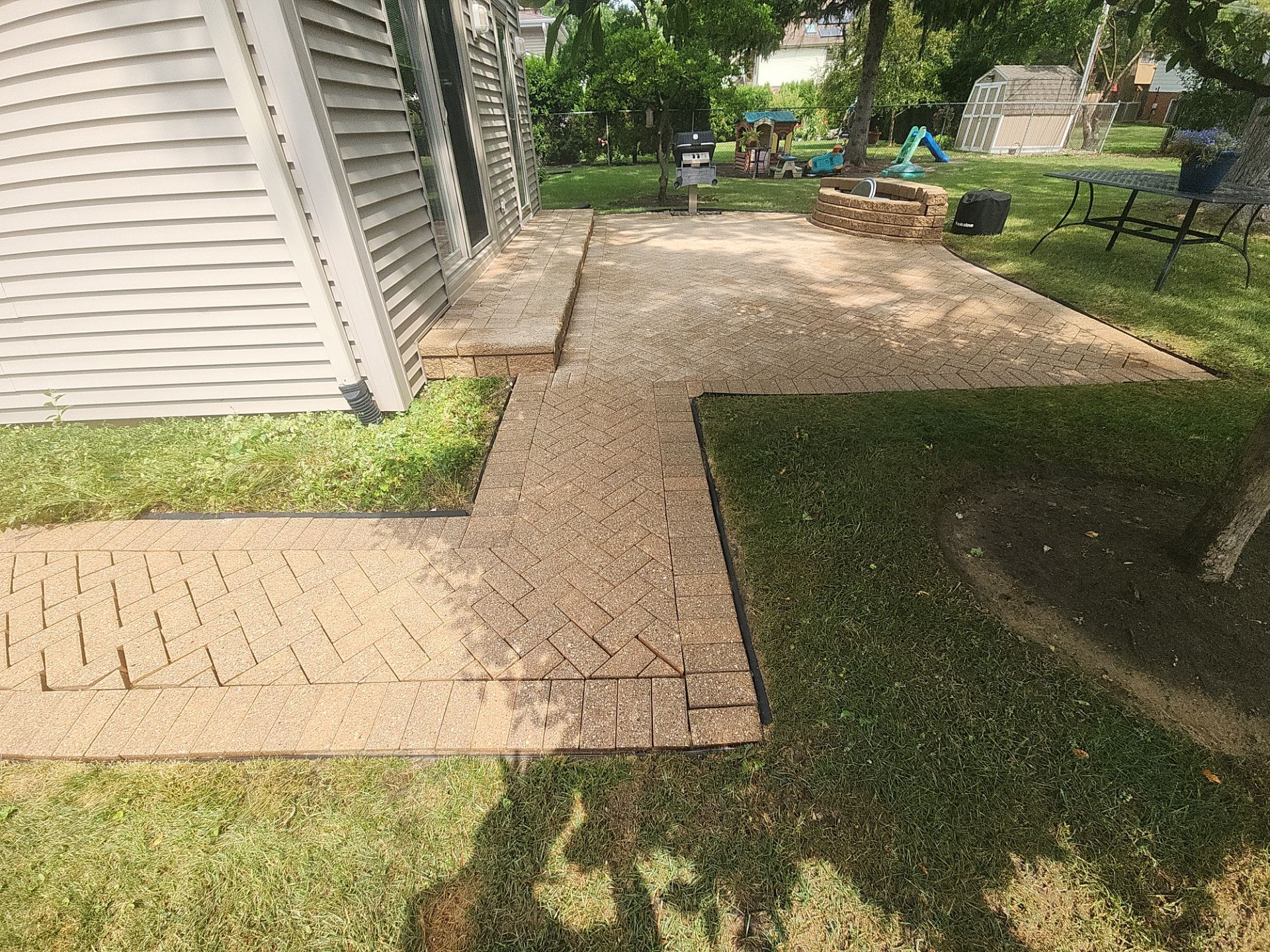 Arlington Heights Brick paver repair, cleaning and sealing by Northern Power Washing LLC.