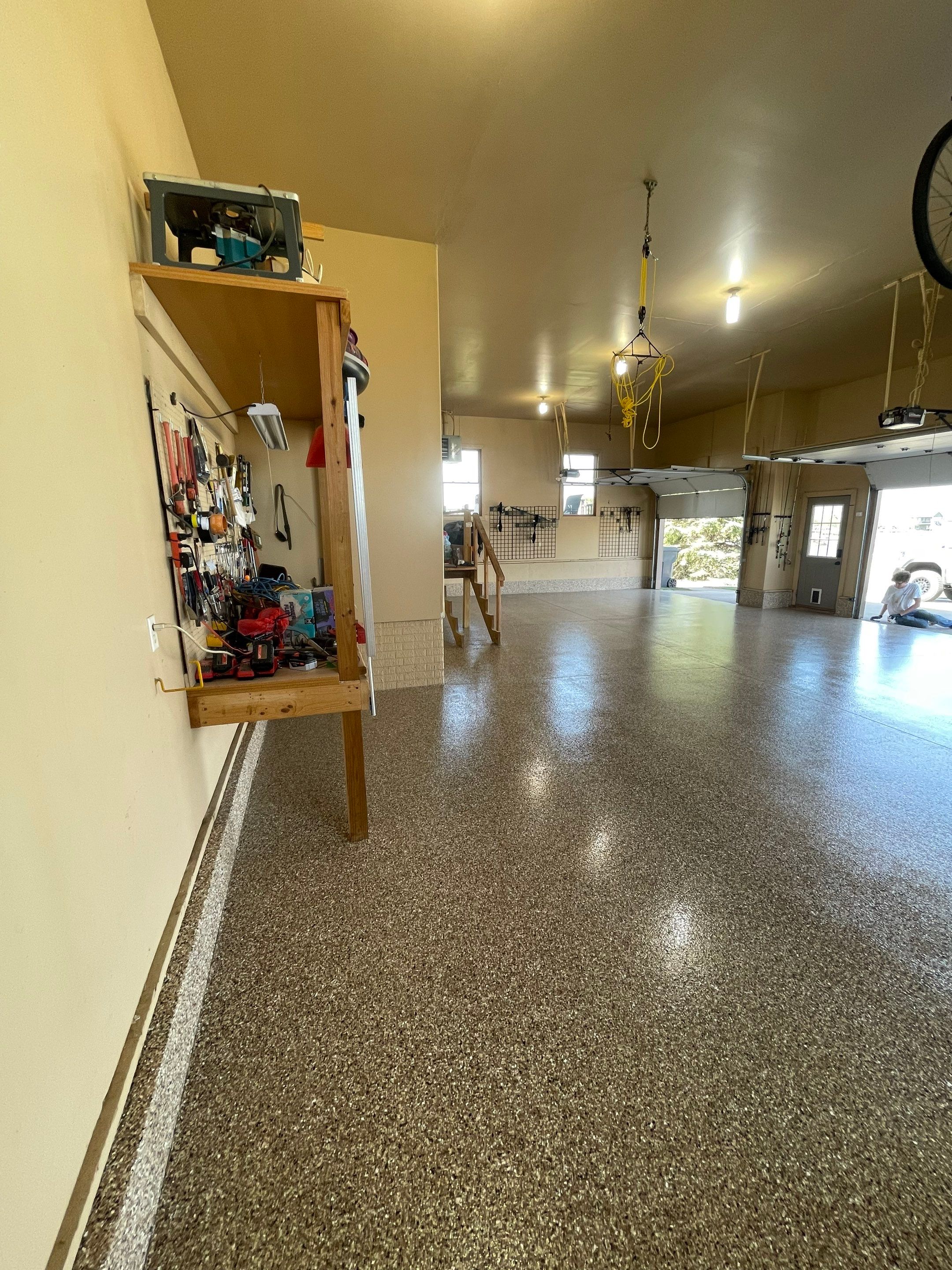 Residential Garage Floor Transformation with Speckled Epoxy Coating by Select Painting, Coatings & Garage Cabinets