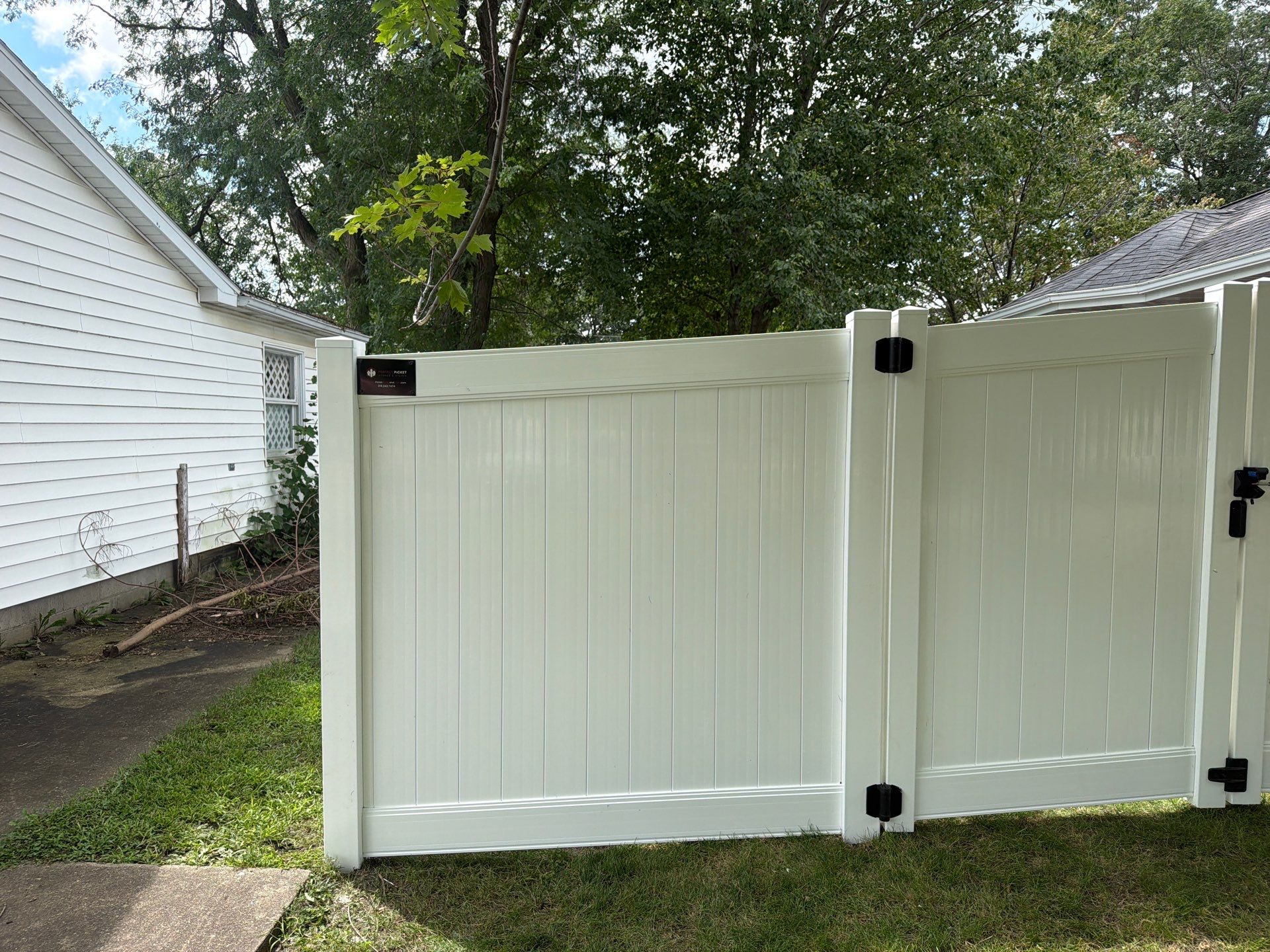Residential White Vinyl Privacy and Black Chain Link Fencing in Jesup by Perfect Picket Fence and Stain