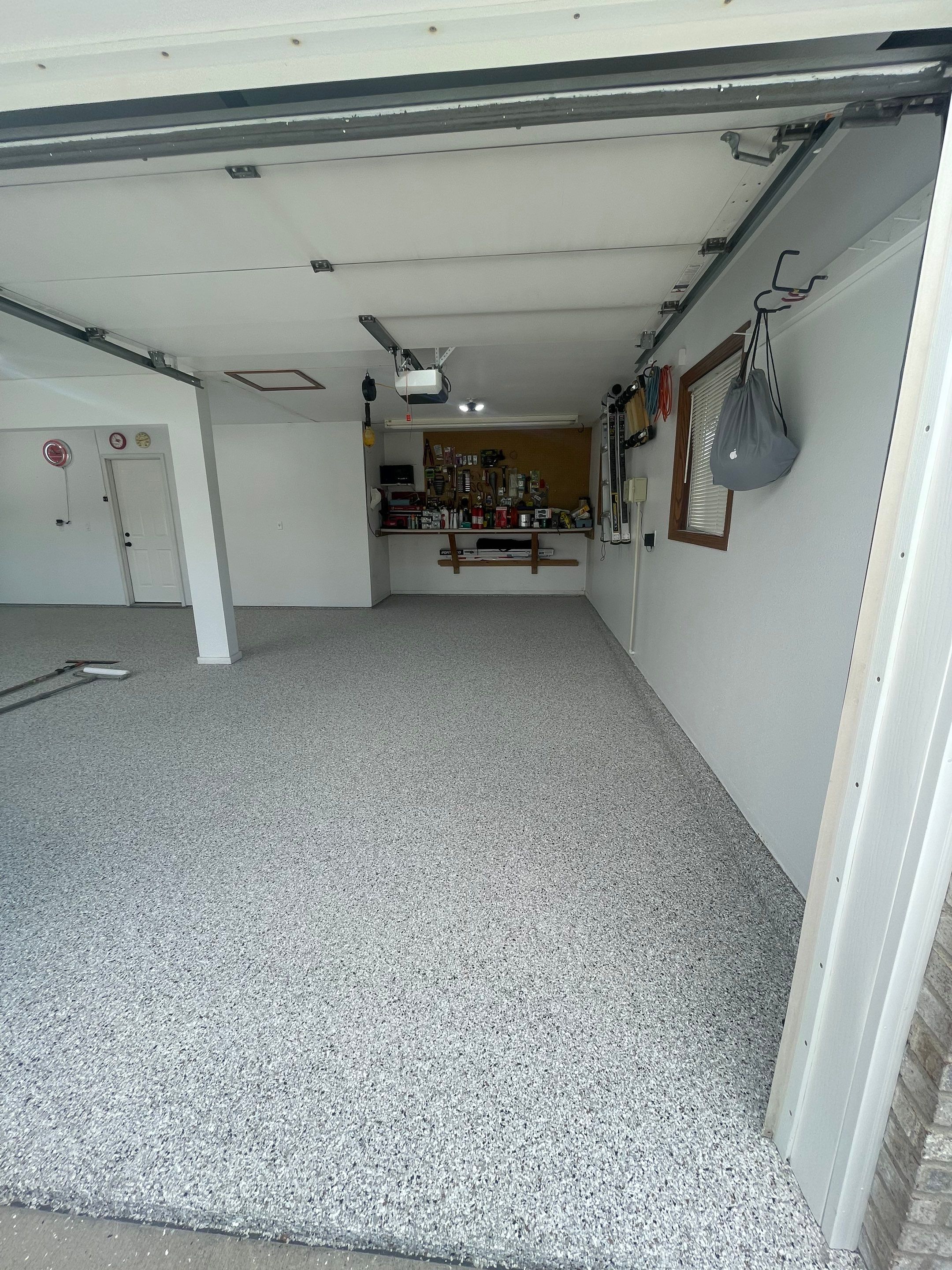 Multi-Car Garage Concrete Coating with Coyote Flake Finish in Sioux Falls by Select Painting, Coatings & Garage Cabinets