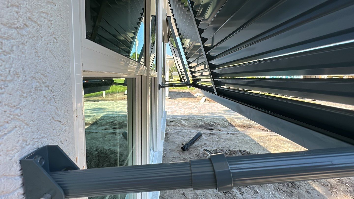 Bahama Shutters in Blue Grey  by Smart Guard Shutters