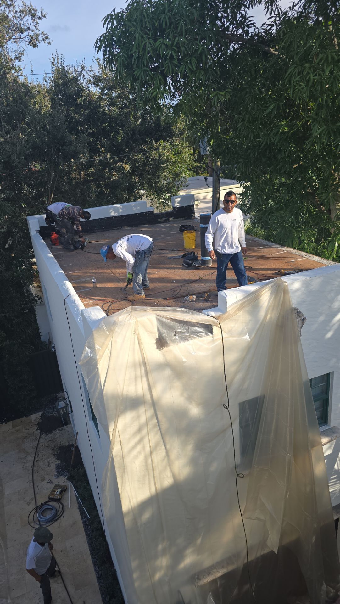 West Palm Beach Roof Restoration and Travertine Paver Driveway Installation by Aastro Roofing