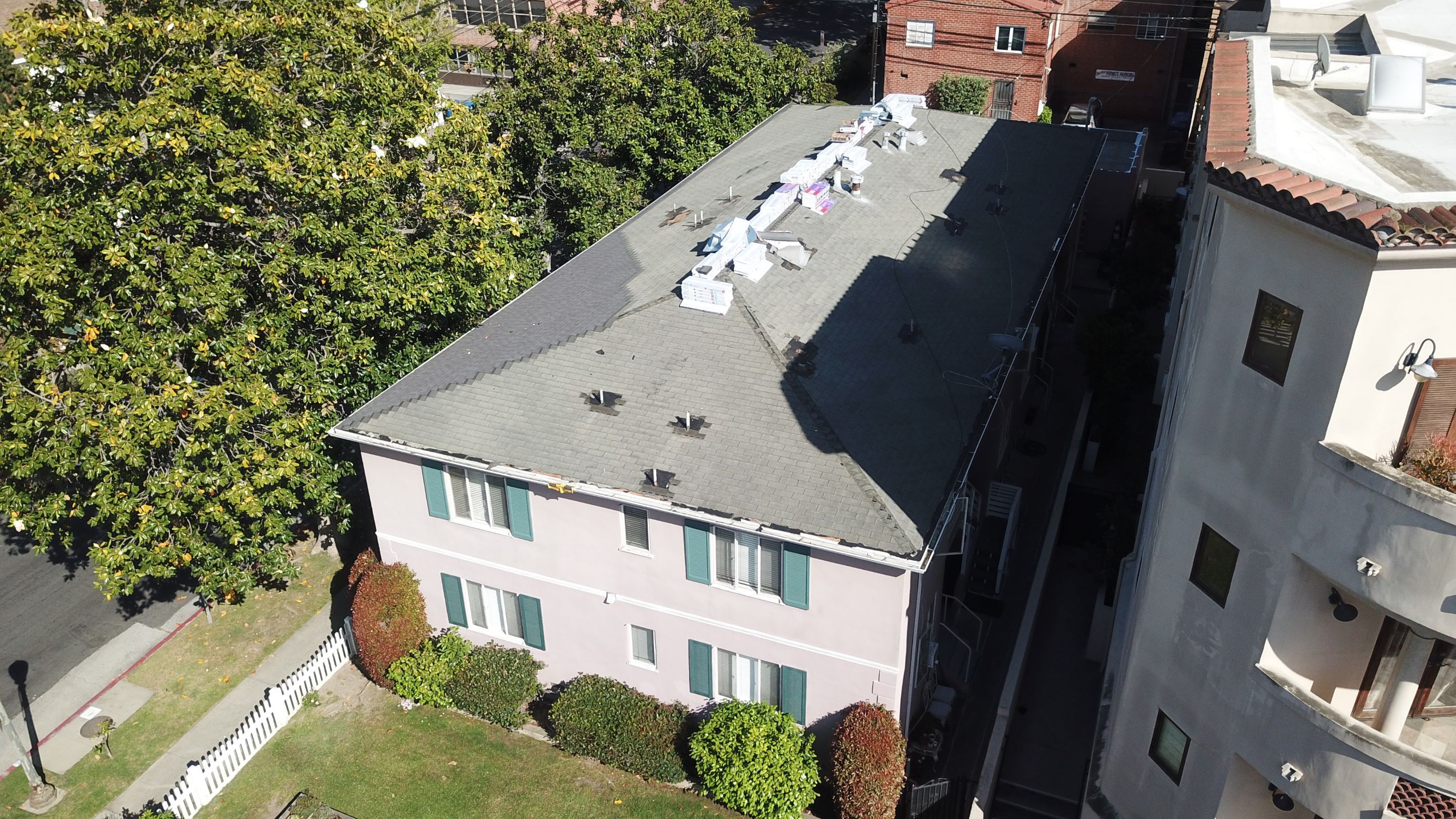 Apartment Building 2nd Layer Installation &Silicone coating by Hull Brothers Roofing