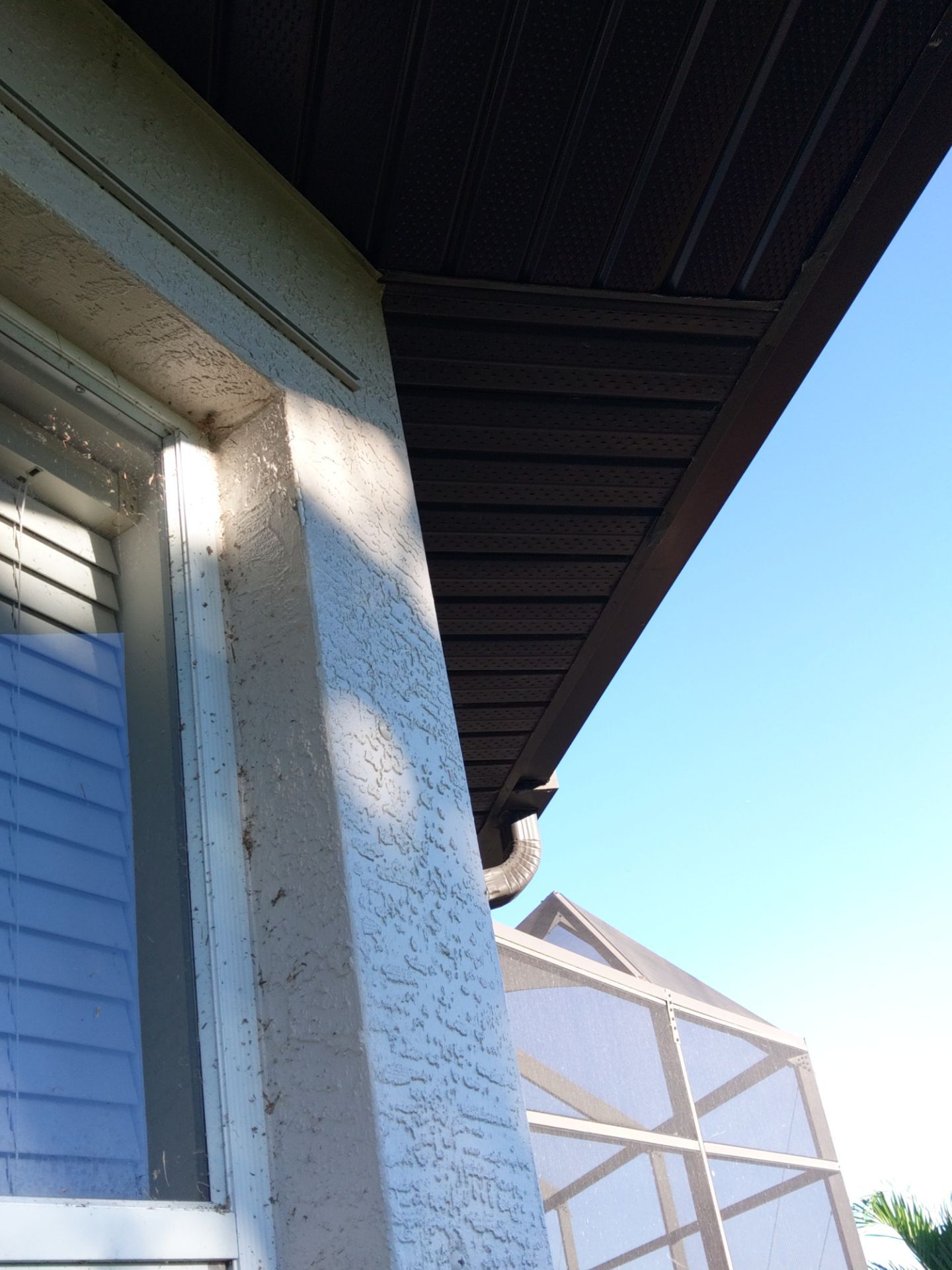 Dark Bronze Soffit Installation in Sarasota FL by Gutter Professors