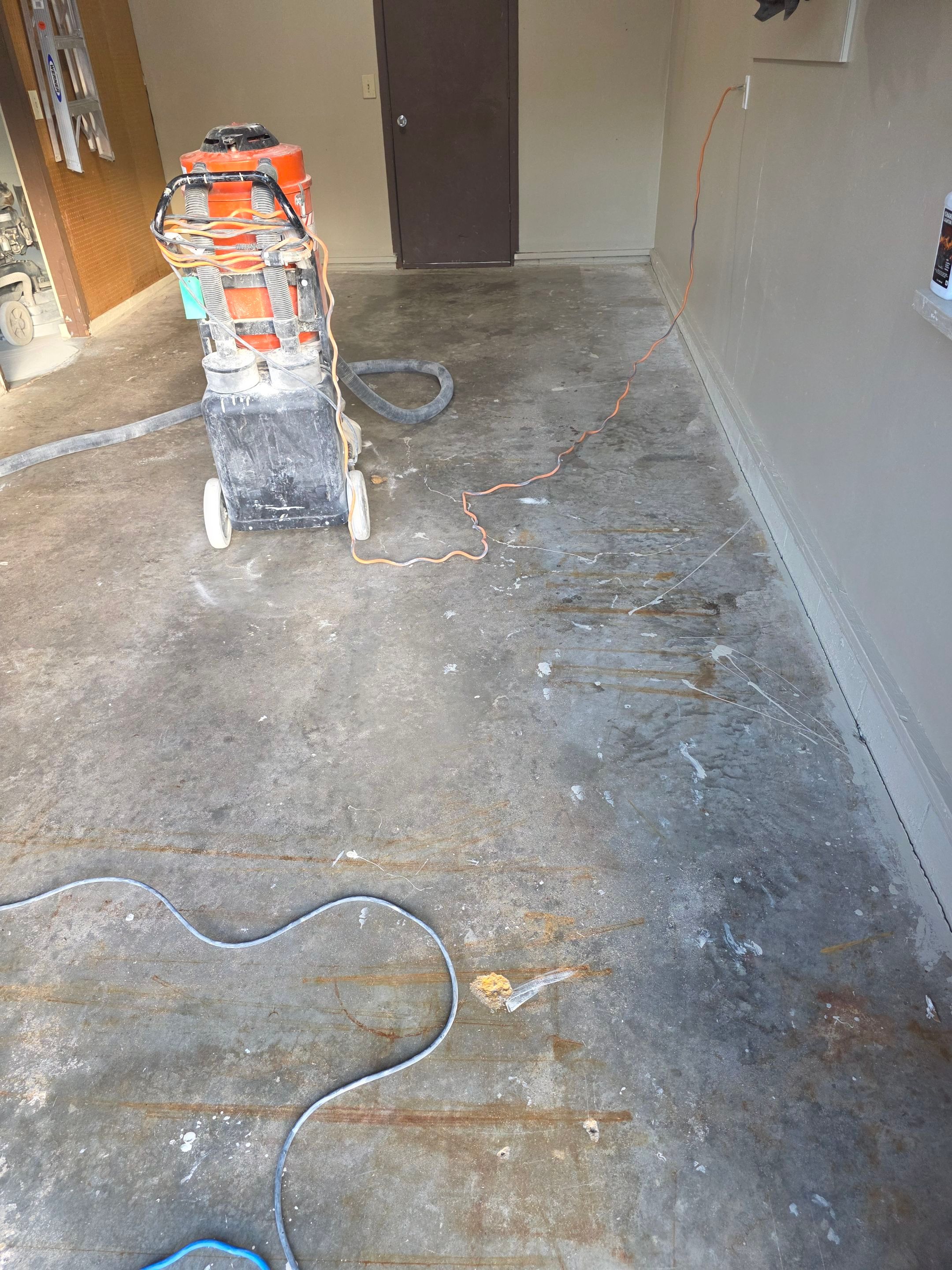 Residential Garage Epoxy Floor Coating Installation in Sioux Falls by Select Painting, Coatings & Garage Cabinets