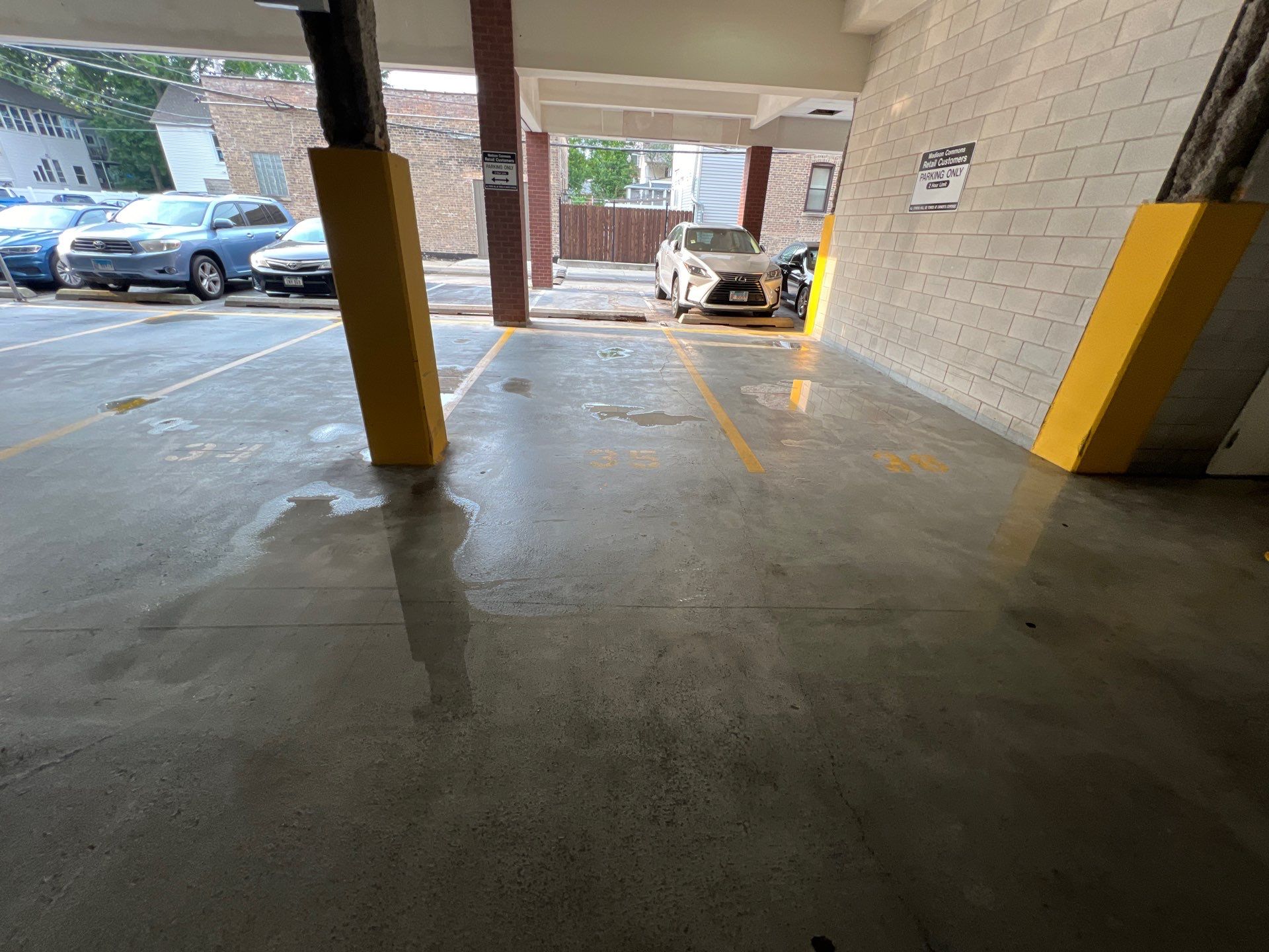 Parking garage using Hot water by Northern Power Washing LLC.