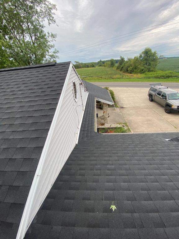 Storm damage roof replacement by Nitro Roofing and Construction