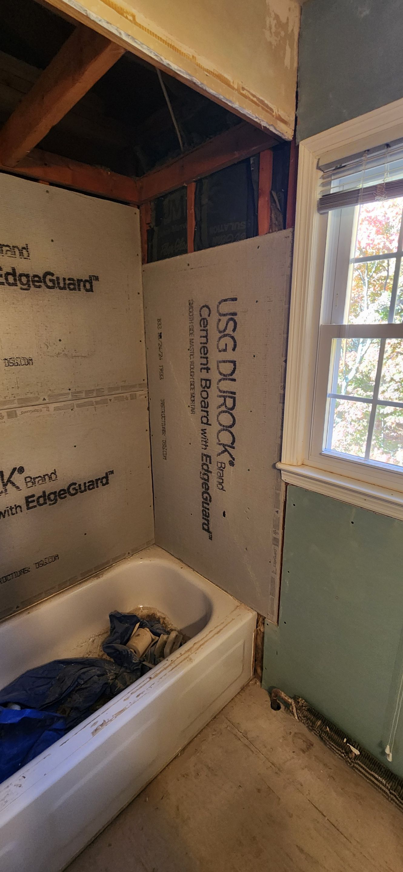 Bathroom Remodel using Porceline Tile from The Tile Shop by Footprints Floors Morristown