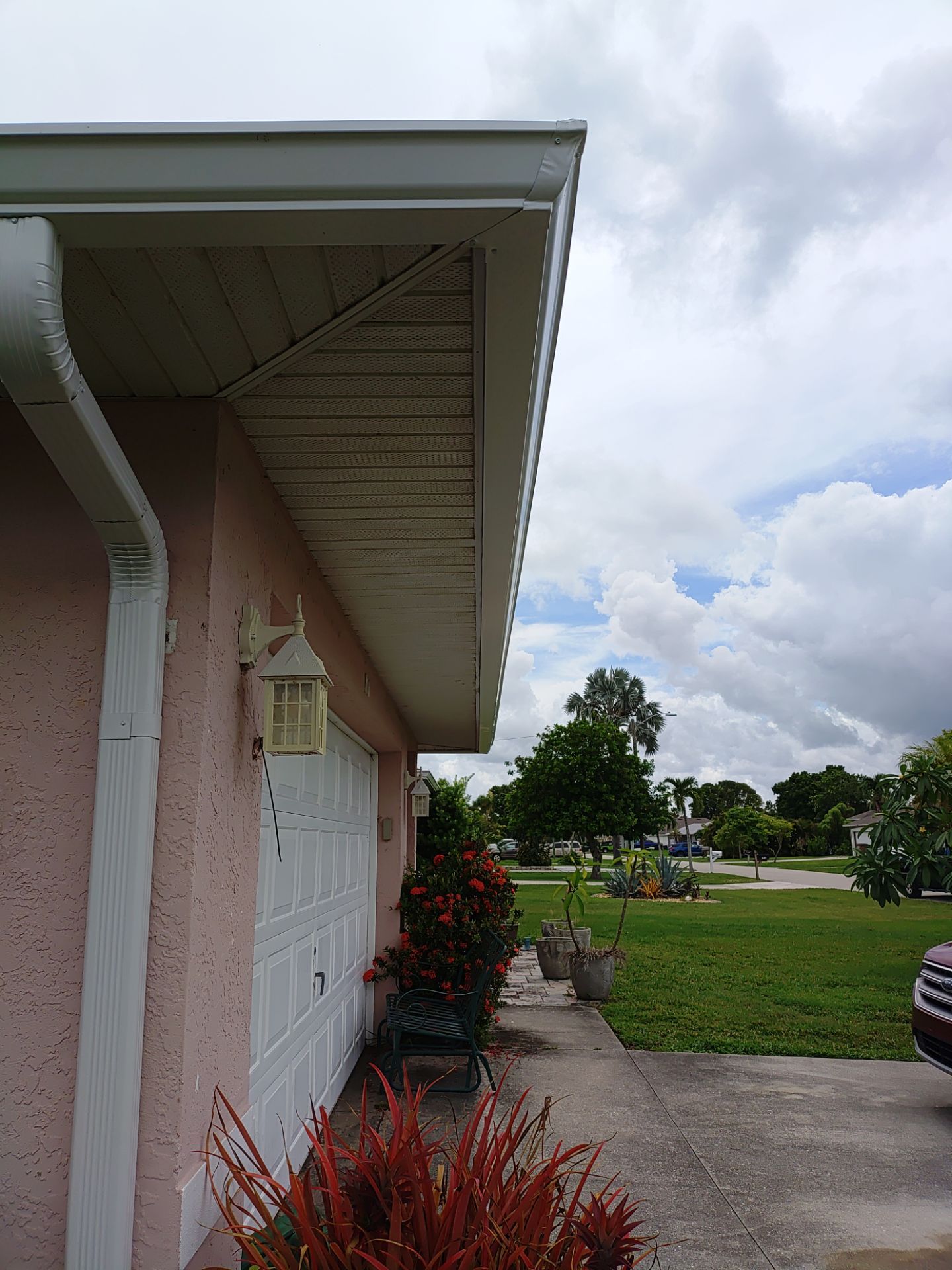 Replace gutter using White Down Spouts in Cape Coral FL by Gutter Professors