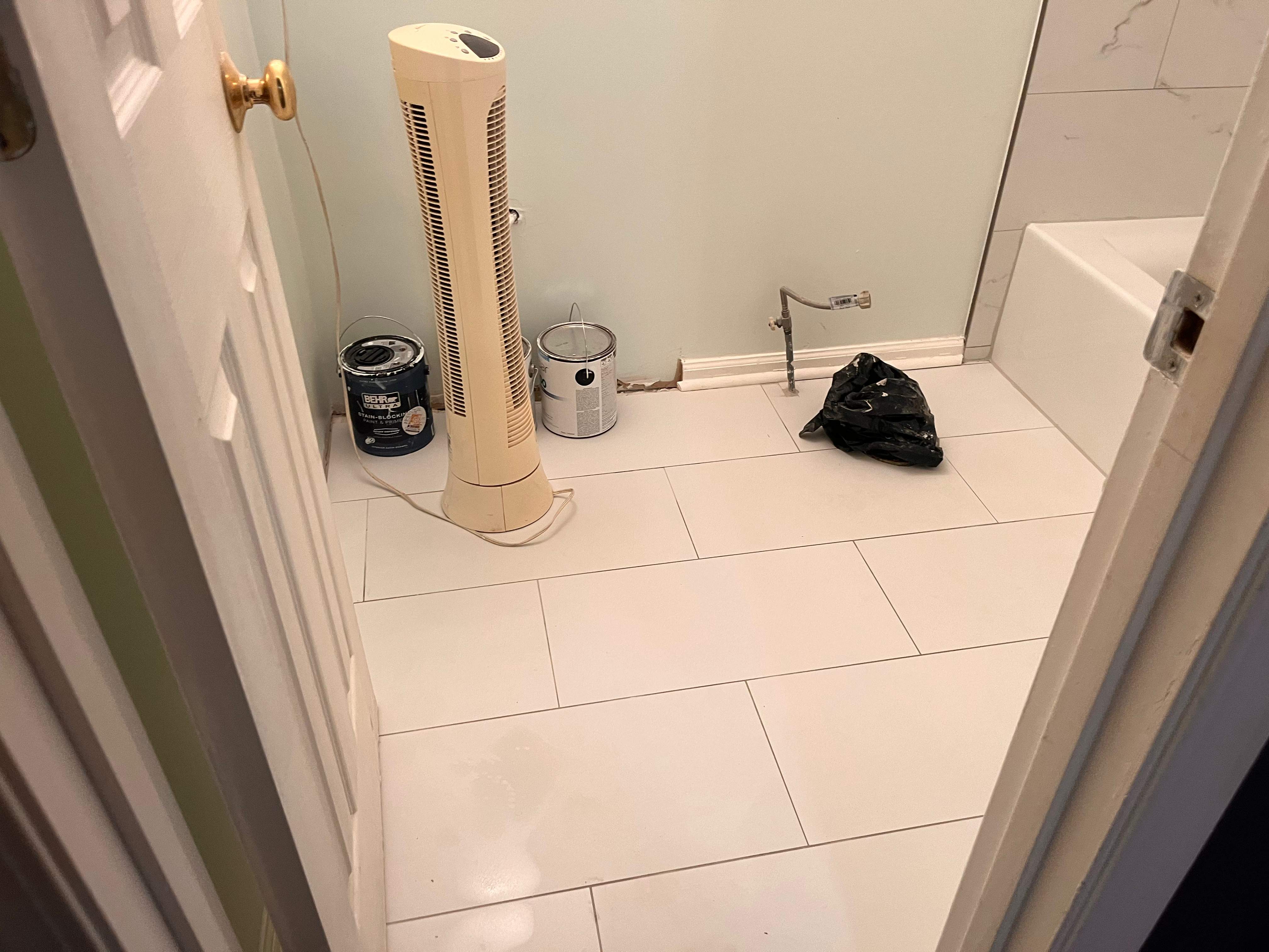 Guest bathroom tub and flooring by Prudencio
