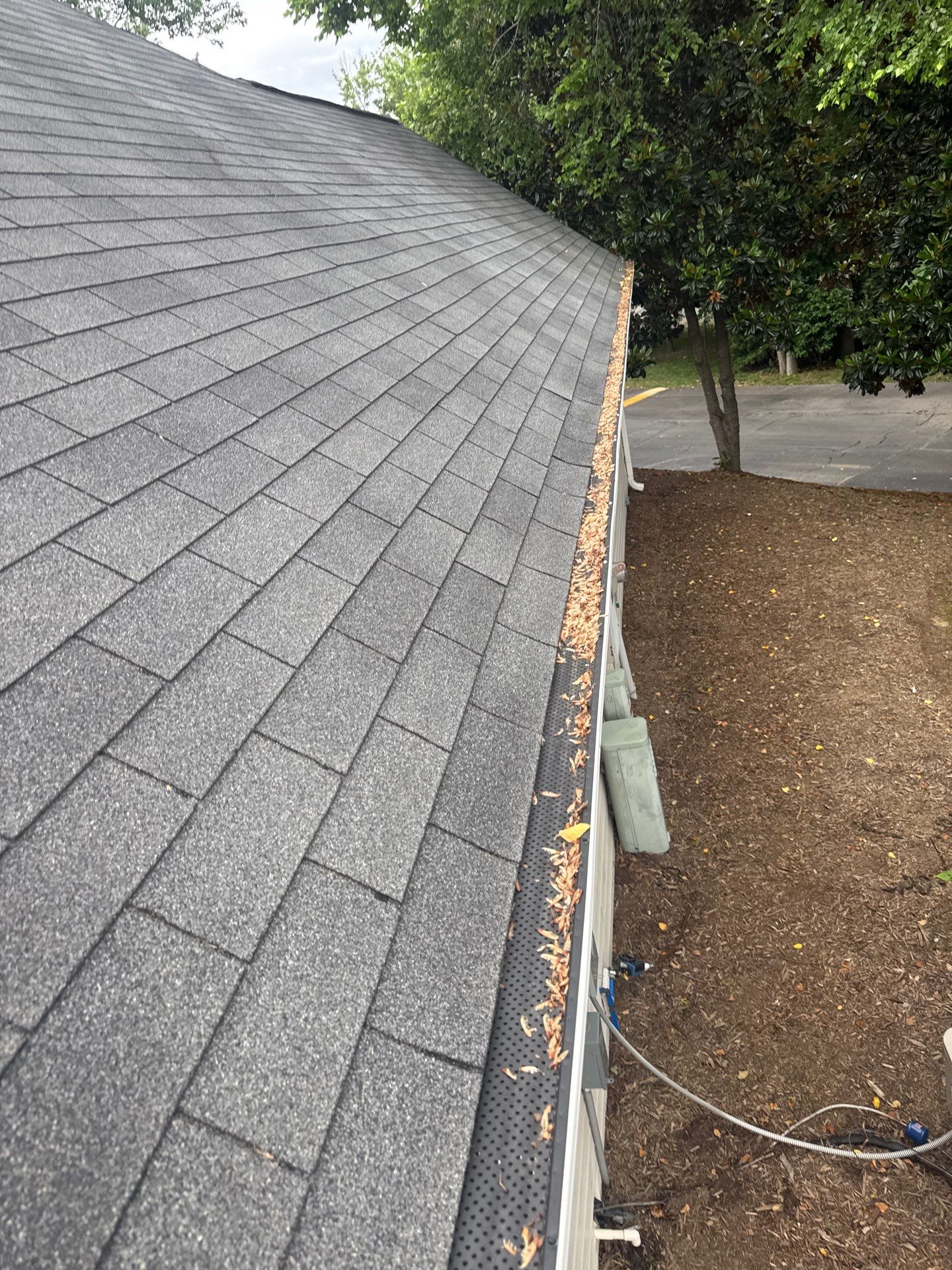 Commercial gutter cleaning Rock Hill & Fort Mill, SC before photo with filled gutters